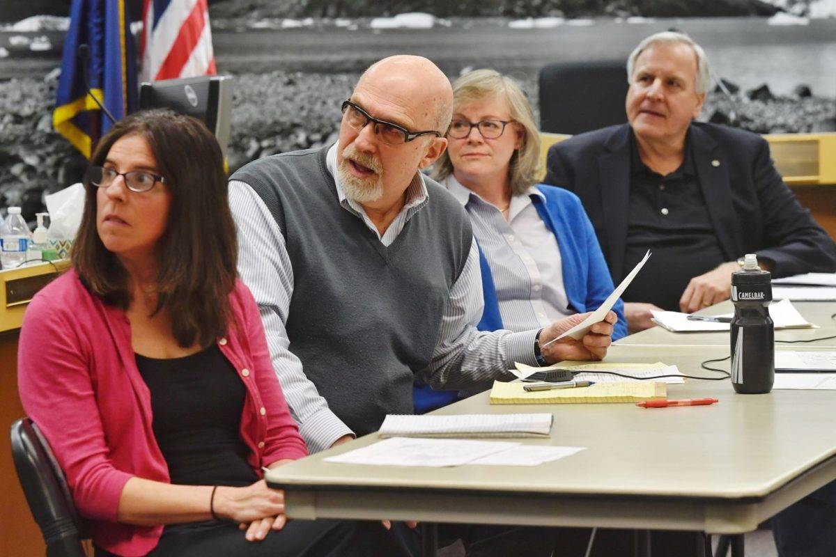 Former Alaska Supreme Court Chief Justice Bud Carpeneti, board member for the New JACC Partnership, second from the left, describes one of three proposals for New JACC and Centennial Hall improvements during a Assembly Standing Committee meeting on Wednesday, March 27, 2019. (Michael Penn | Juneau Empire File)