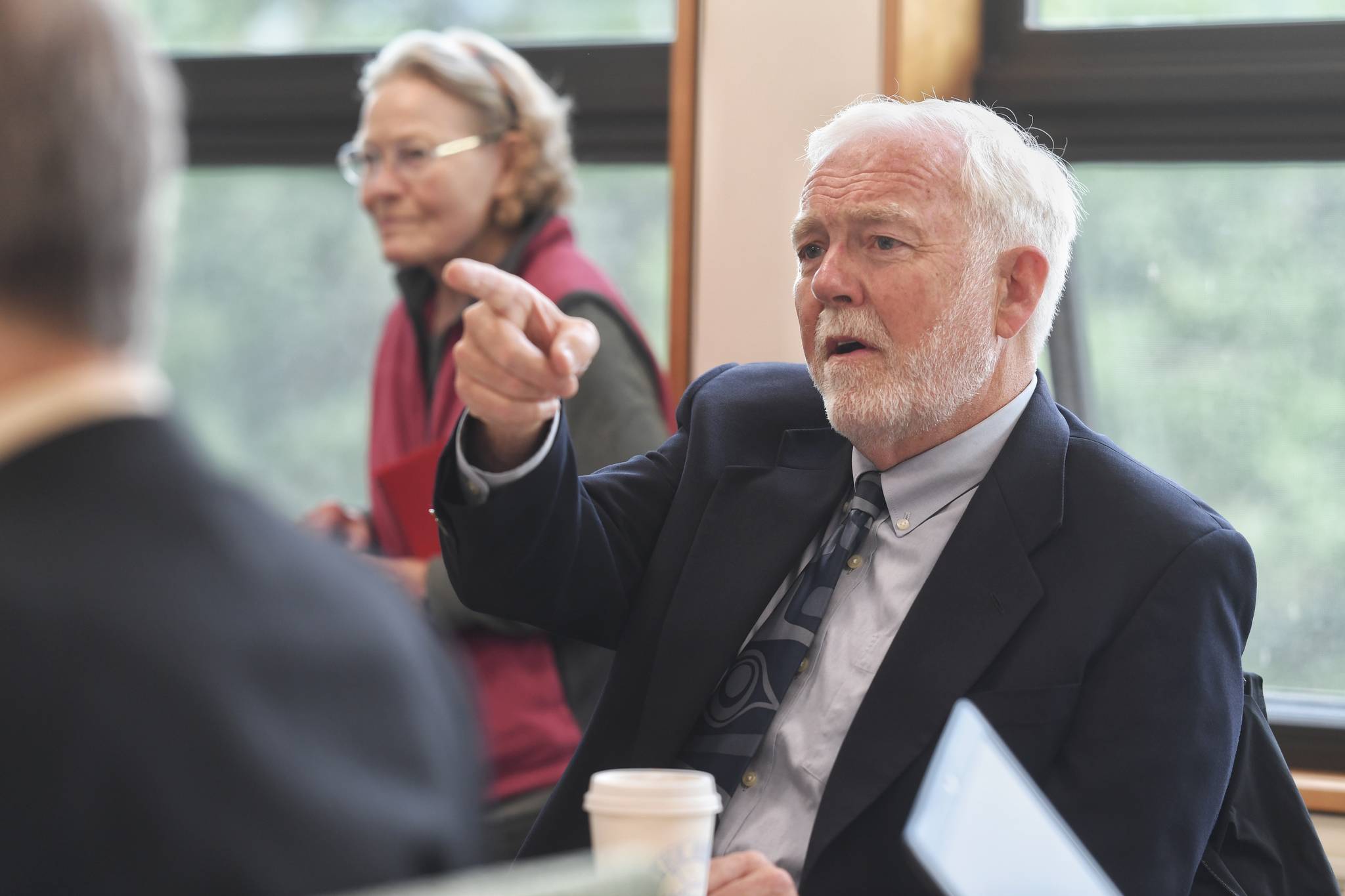 Dr. Richard Caulfield, Chancellor at the University of Alaska Southeast, watches an online meeting being held at UA campuses around the state on Gov. Mike Dunleavy’s budget cuts on Monday, July 15, 2019. (Michael Penn | Juneau Empire File)