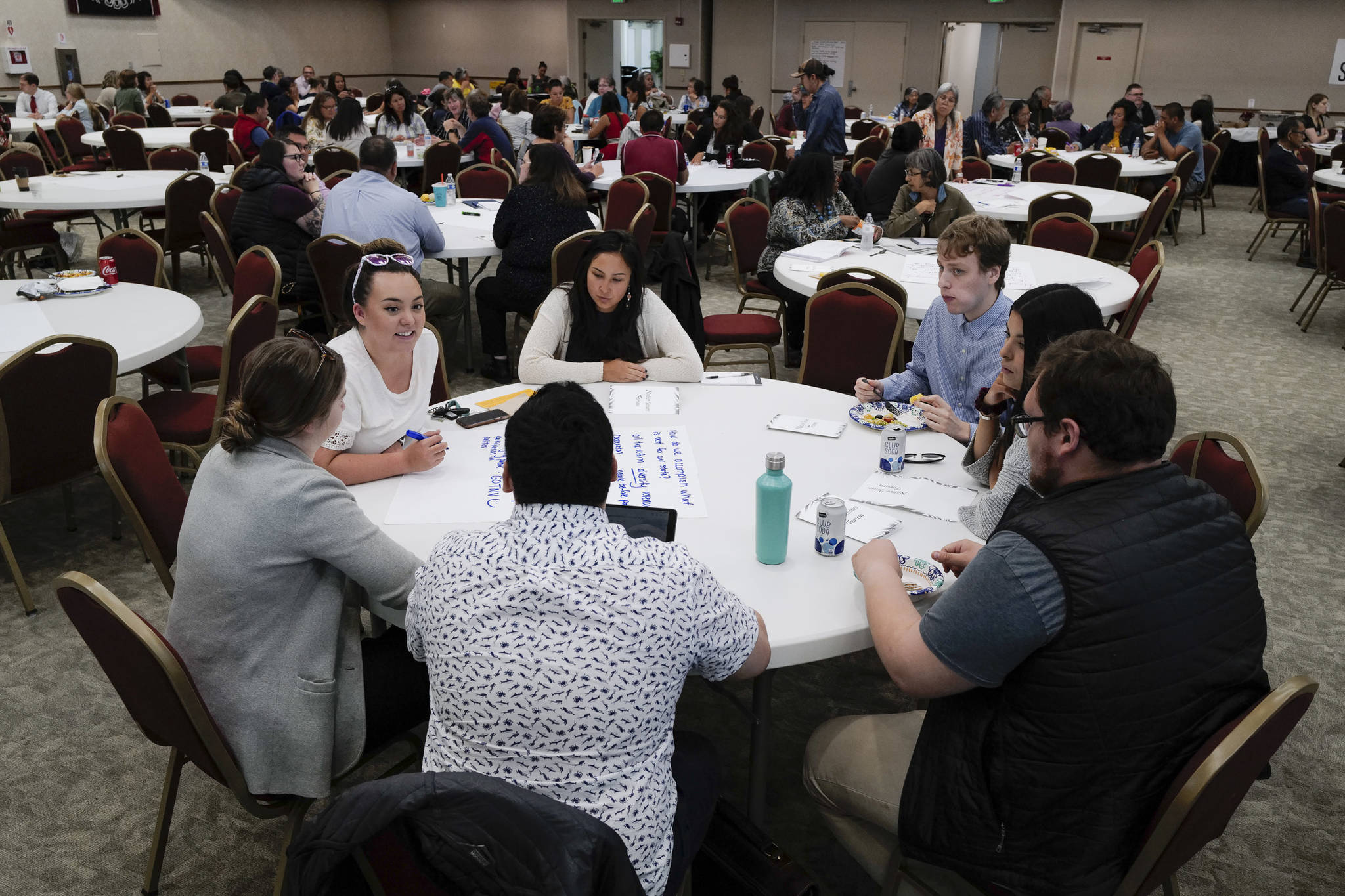 Participants work at tables to list ideas for a better Alaska during a Special Native Issues Forum at Elizabeth Peratrovich Hall on Tuesday, July 30, 2019. The forum was sponsored by Tlingit Haida, First Alaskans Institute, Native Peoples Action and Sealaska. (Michael Penn | Juneau Empire)