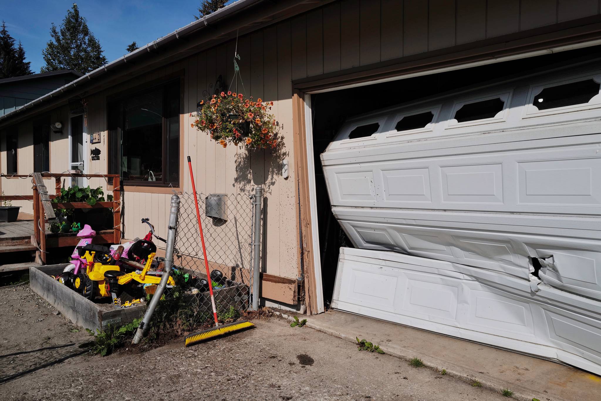 Police say a drunken drive hit this house in the 4400 block of Mendenhall Boulevard on Tuesday, July 30, 2019. Along with a fence and house, two vehicles were also damaged. The Driver did not have insurance, according to the house owner Amy Roemer. (Michael Penn | Juneau Empire)