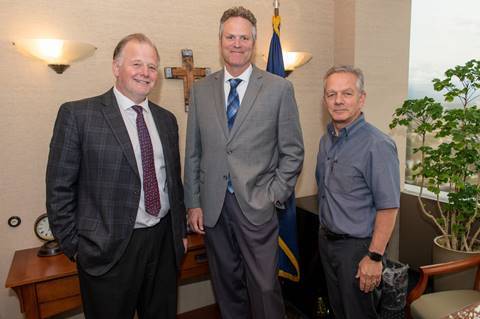 Tuckerman Babcock, Gov. Mike Dunleavy and Ben Stevens pose for a picture Wednesday in Anchorage. (Courtesy photo | Governor’s Office)