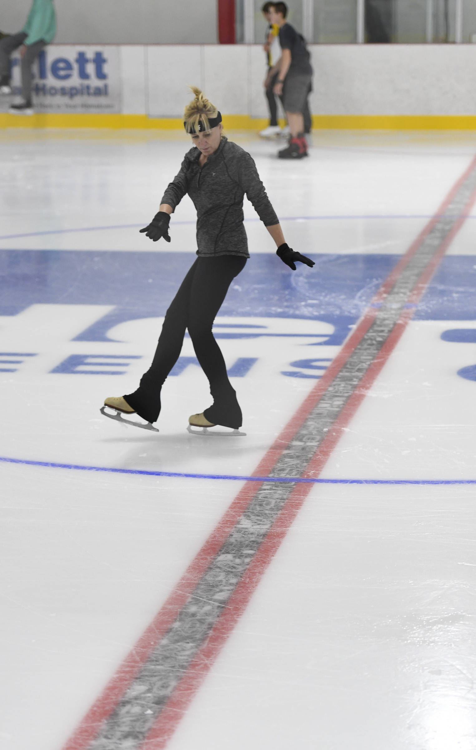 Wendy Buille practices her figure skating during a free skate on the opening day at the Treadwell Arena on Monday, Aug. 5, 2019. (Michael Penn | Juneau Empire)