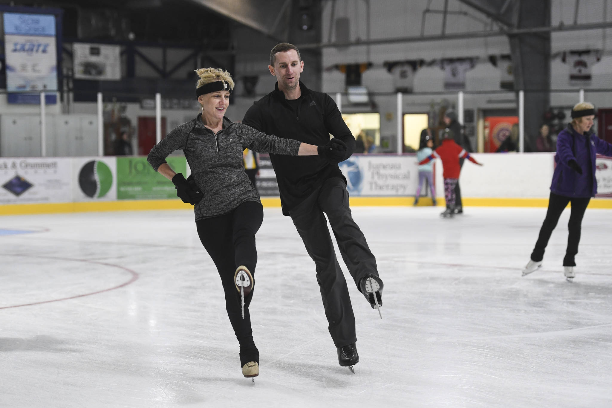 Wendy Buille and Ryan Kauzoarich practice their pair figure skating during a free skate on the opening day at the Treadwell Arena on Monday, Aug. 5, 2019. (Michael Penn | Juneau Empire)