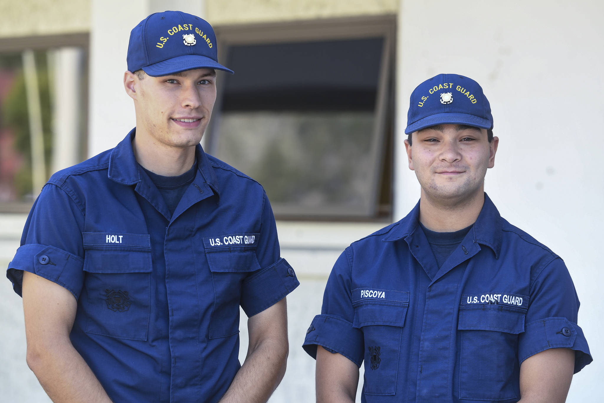 Seamen Logan Holt, left, and Daniel Piscoya pose outside of U.S. Coast Guard Station Juneau on Friday, Aug. 9, 2019. Both are taking advantage of the Coast Guard’s College Student Pre-Commissioning Initiative program and have recently returned from basic training. (Michael Penn | Juneau Empire)