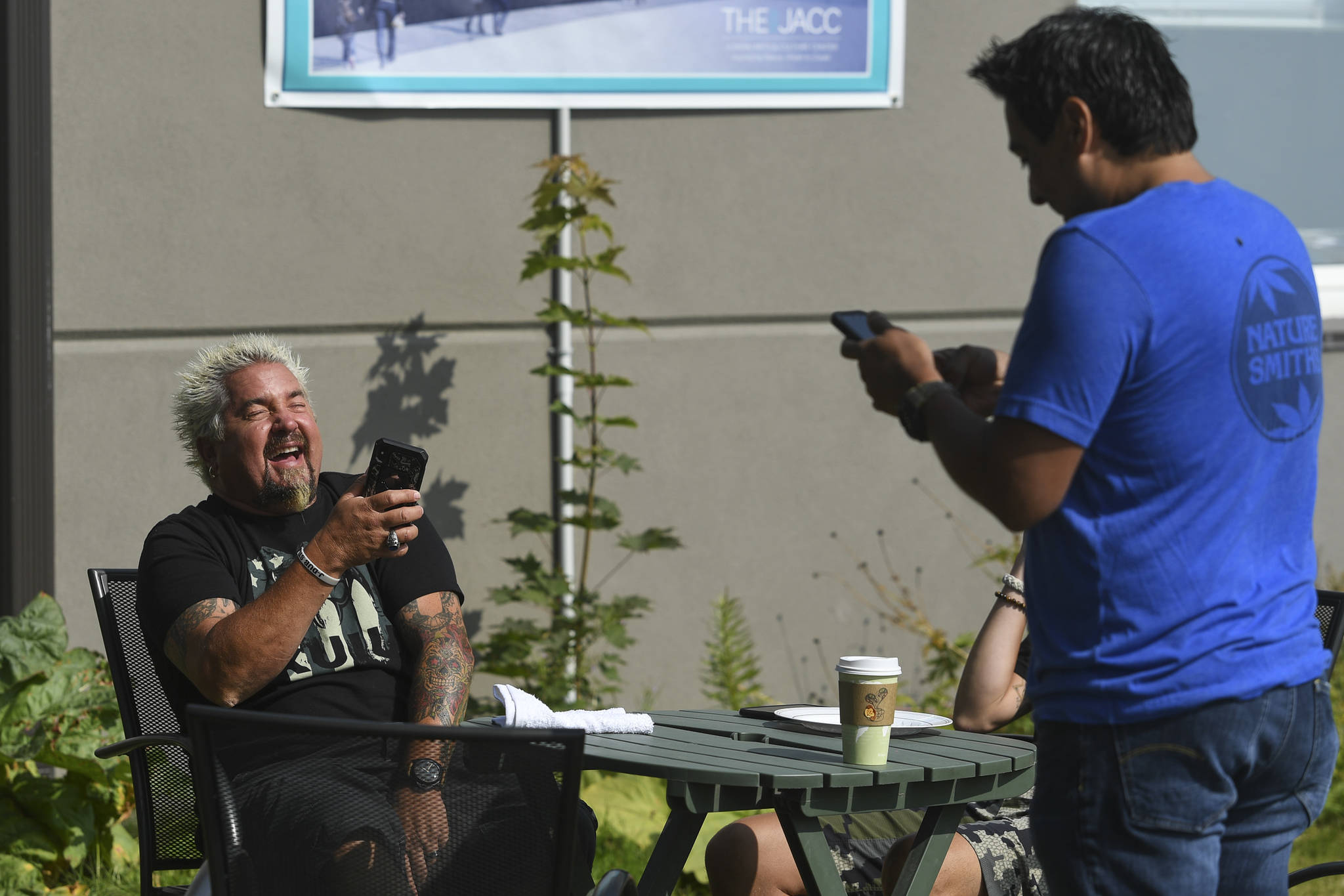 Guy Fieri, host of Diners, Drive-Ins and Dives, reacts while in front of the Juneau Arts & Culture Center on Tuesday, Aug. 13, 2019. Fieri has been seen filming at Pucker Wilson’s, Bun Daddy, Forno Rosso Pizzeria, Zerelda’s Bistro and In Bocca Al Lupo. (Michael Penn | Juneau Empire)