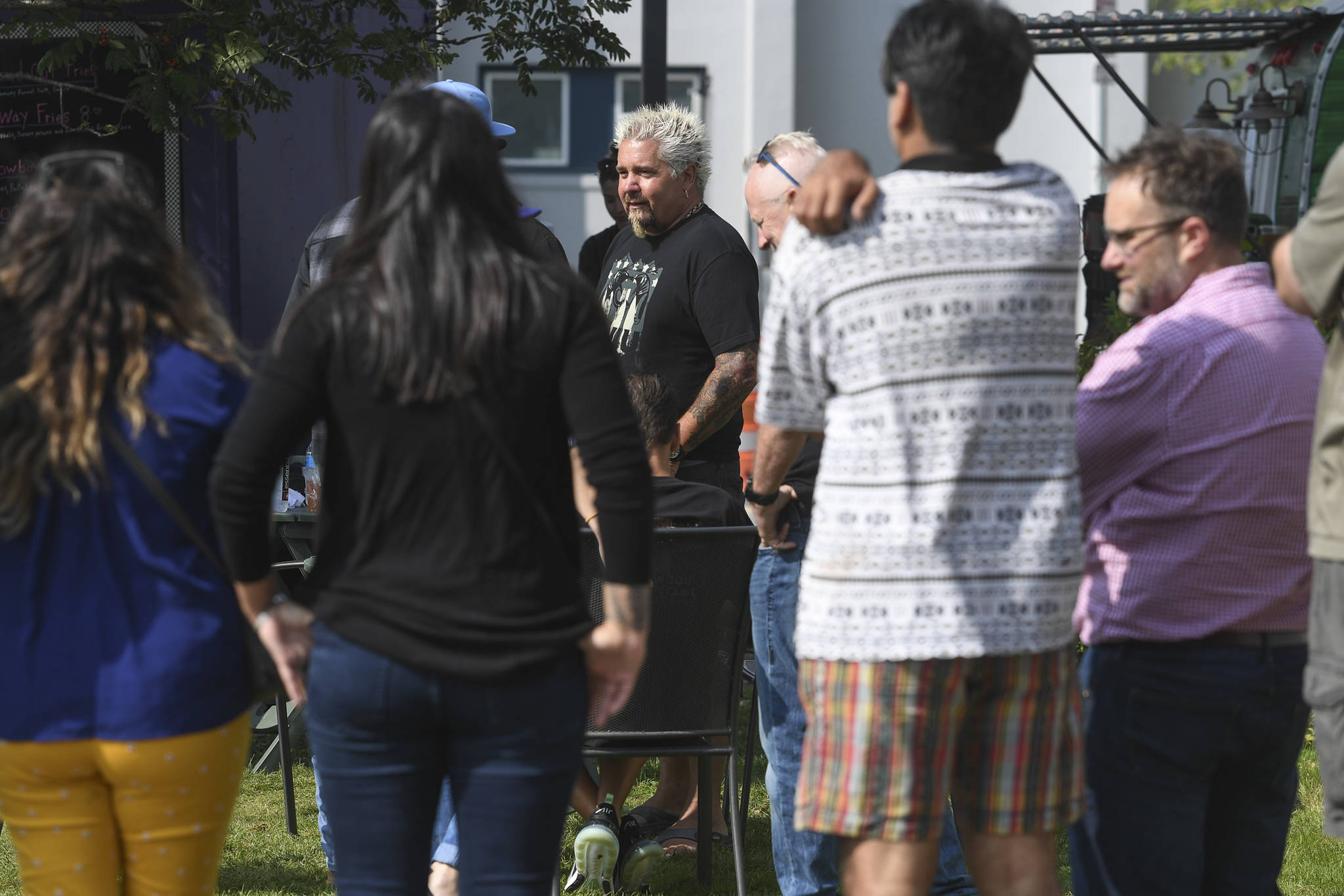 Guy Fieri, host of Diners, Drive-Ins and Dives, in front of the Juneau Arts & Culture Center on Tuesday, Aug. 13, 2019. Fieri has been seen filming at Pucker Wilson’s, Bun Daddy, Forno Rosso Pizzeria, Zerelda’s Bistro and In Bocca Al Lupo. (Michael Penn | Juneau Empire)