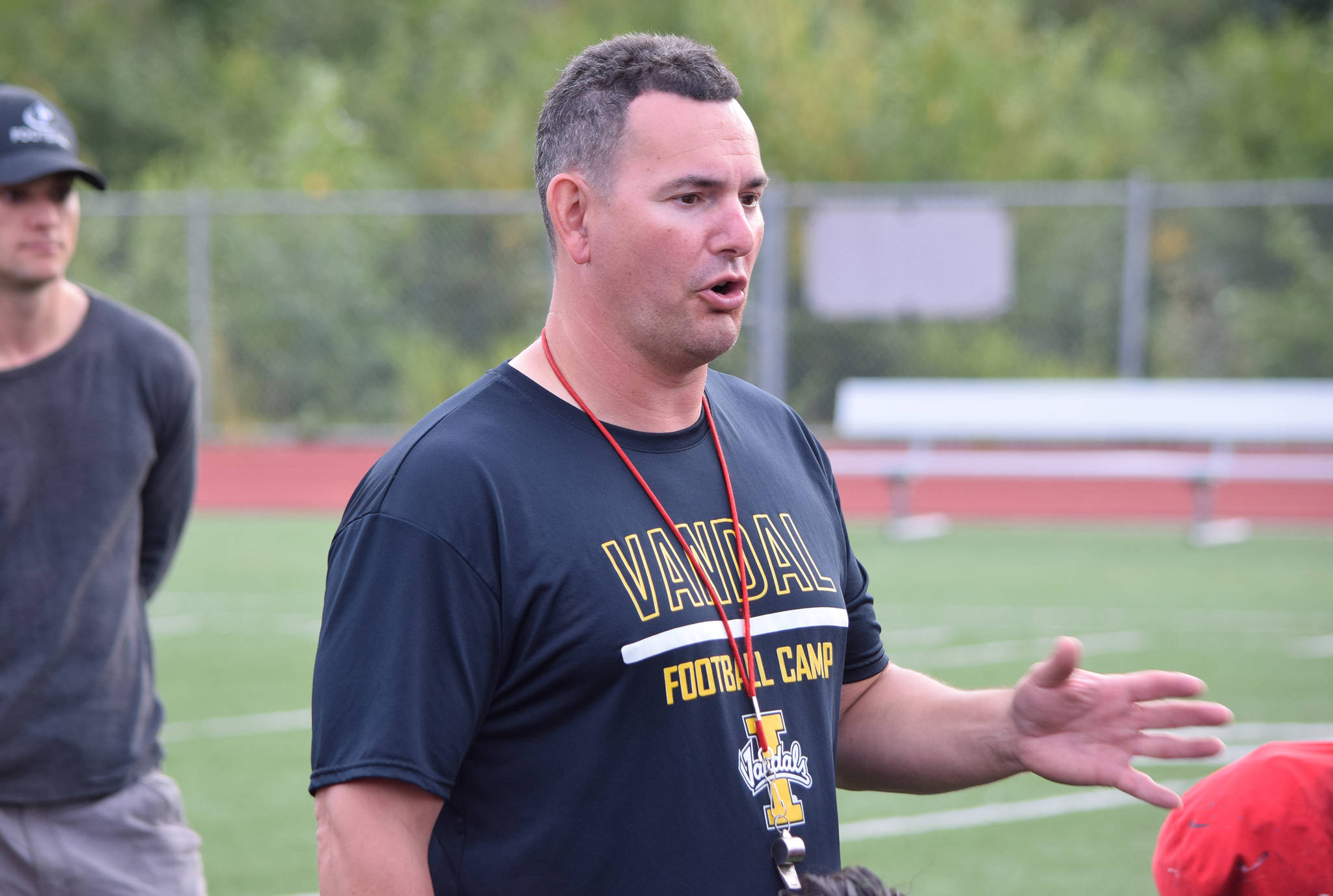 Juneau Huskies football coach Rich Sjoroos speaks to his team after practice at Thunder Mountain High School on Wednesday, Aug. 14, 2019. (Nolin Ainsworth | Juneau Empire)