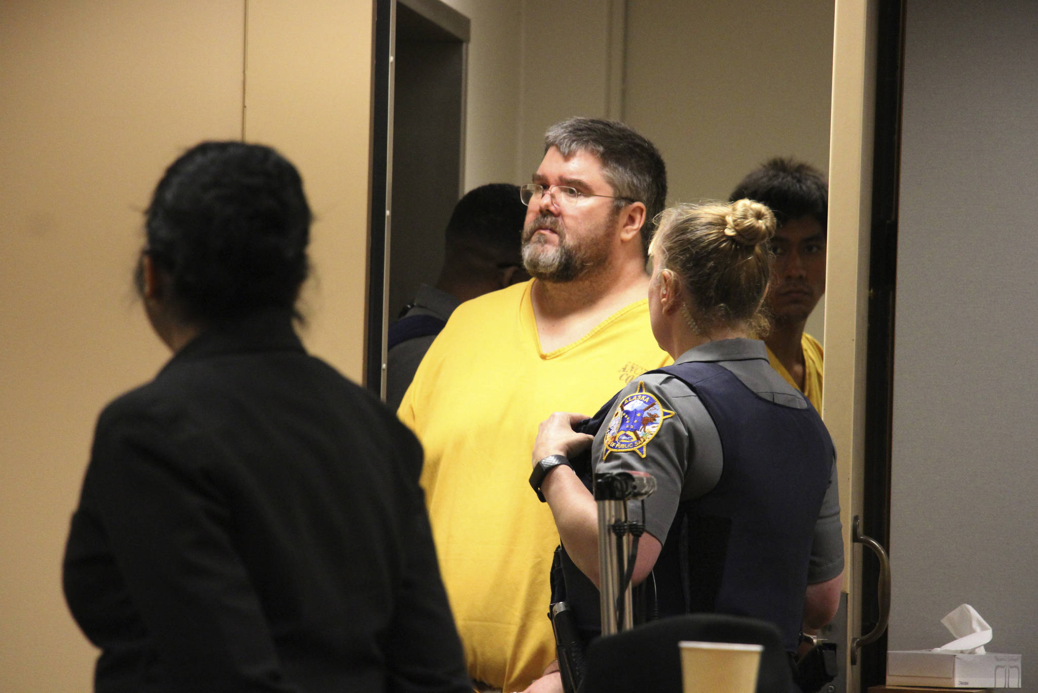 In this Aug. 6 photo, Steven Downs is led into a courtroom for arraignment in Anchorage. Downs has pleaded not guilty after being charged in the sexual assault and murder of a woman in Alaska in a case that remained unsolved for years. Downs entered his plea Wednesday in a courtroom in Fairbanks. He is charged in the death of Sophie Sergie, who was found stabbed and shot in a bathtub at a University of Alaska Fairbanks dormitory. (AP Photo | Mark Thiessen)