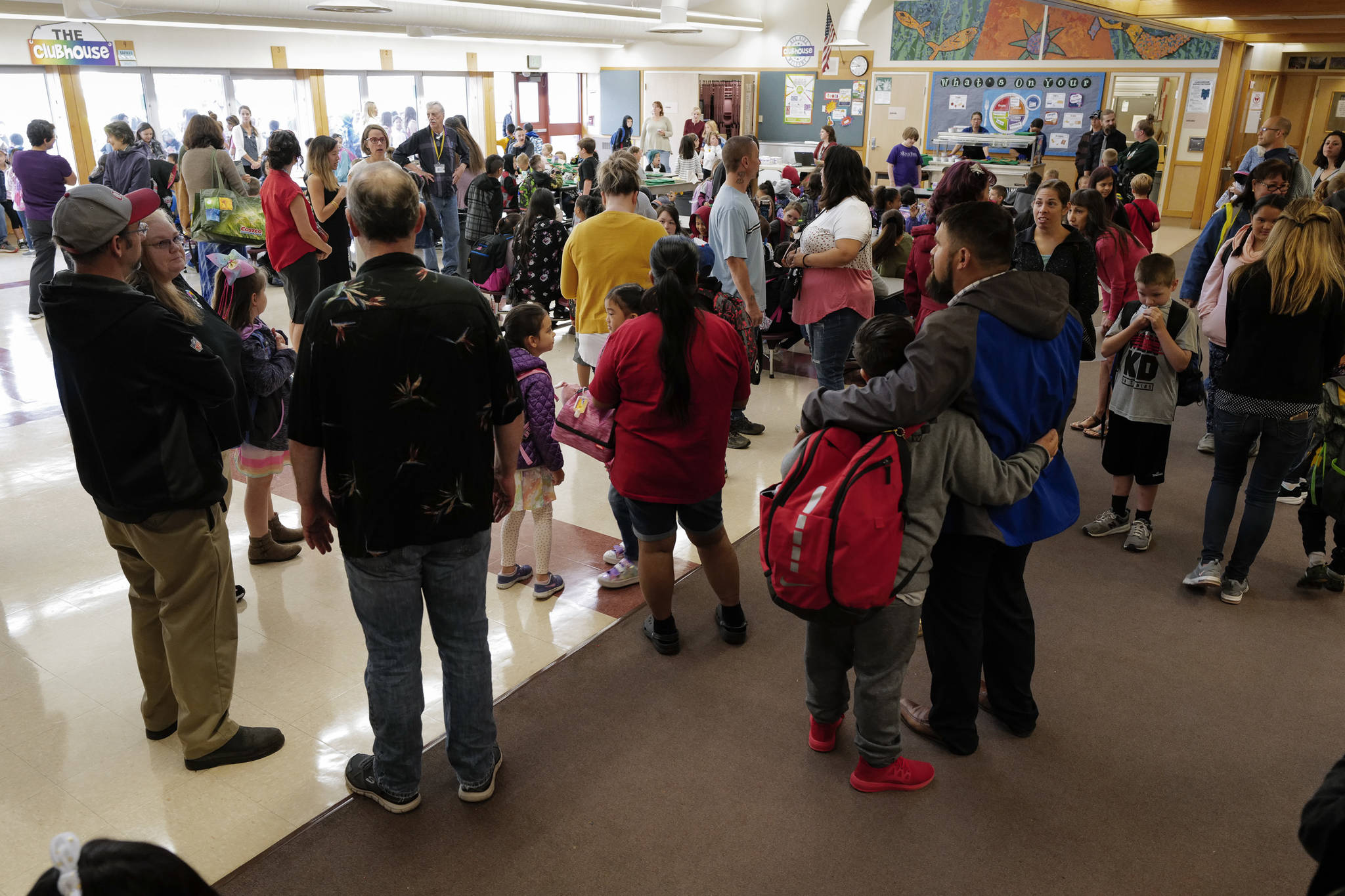 Teachers, parents and students gather at of Riverbend Elementary School on the first day of school on Monday, Aug. 19, 2019. (Michael Penn | Juneau Empire)