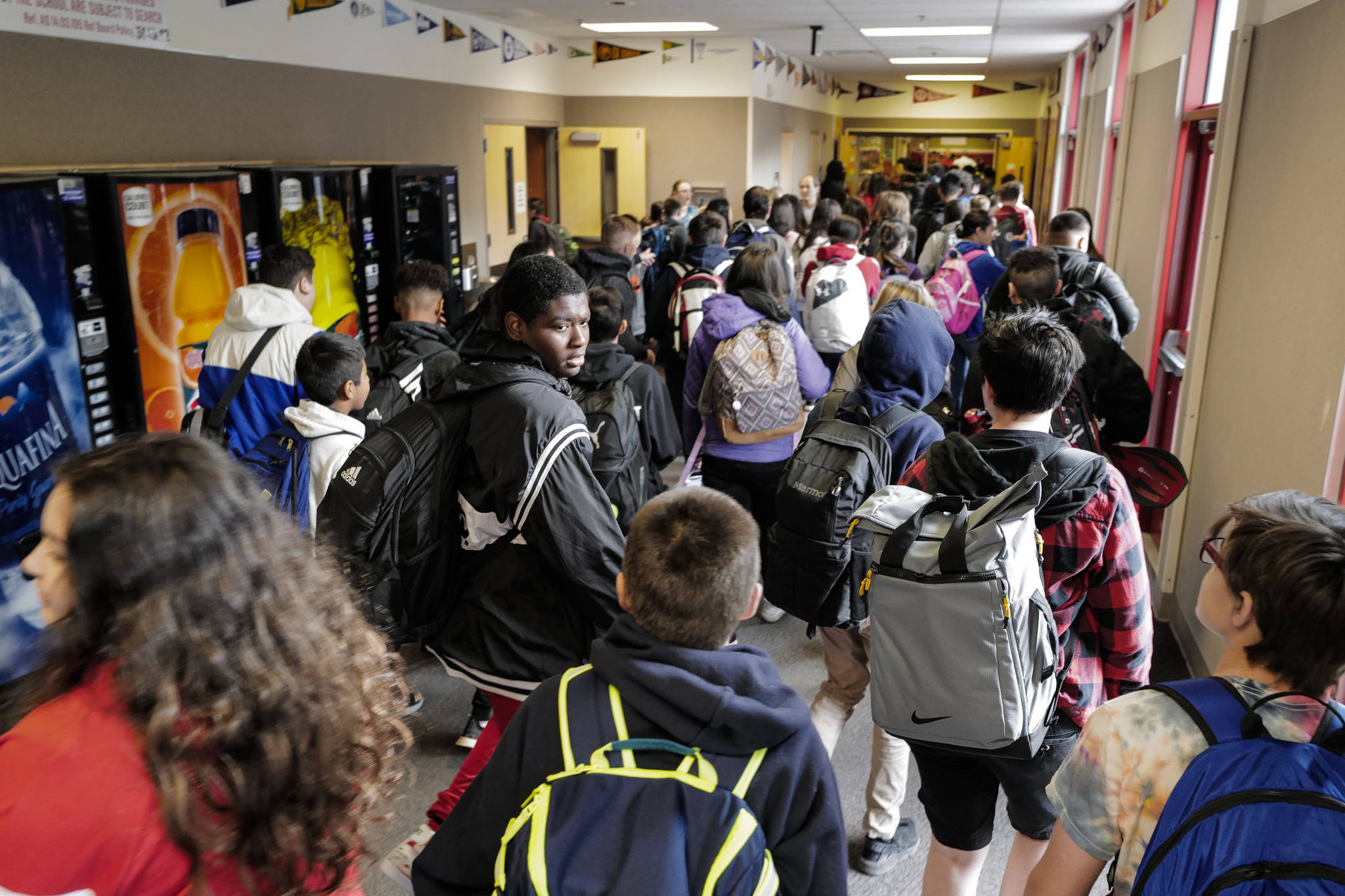 Students head for their classrooms on the first day of school at Floyd Dryden Middle School on Monday, Aug. 19, 2019. (Michael Penn | Juneau Empire)
