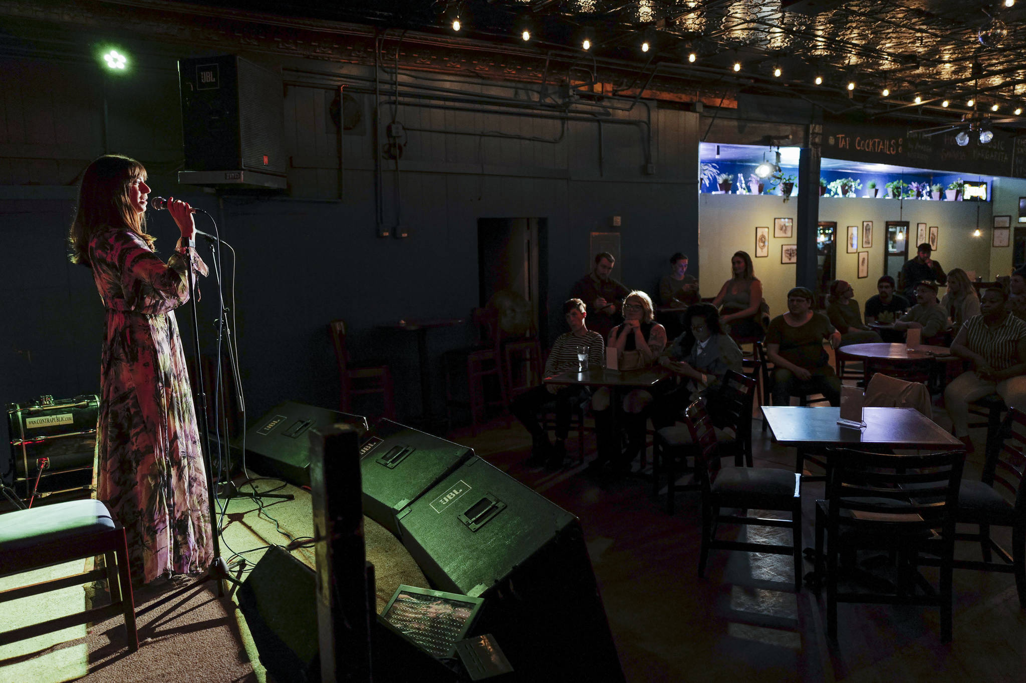 Dana Herndon performs with a story of Cleopatra during the GRLZ open mic night at the The Rendezvous Bar on Wednesday, Aug. 14, 2019. (Michael Penn | Juneau Empire)