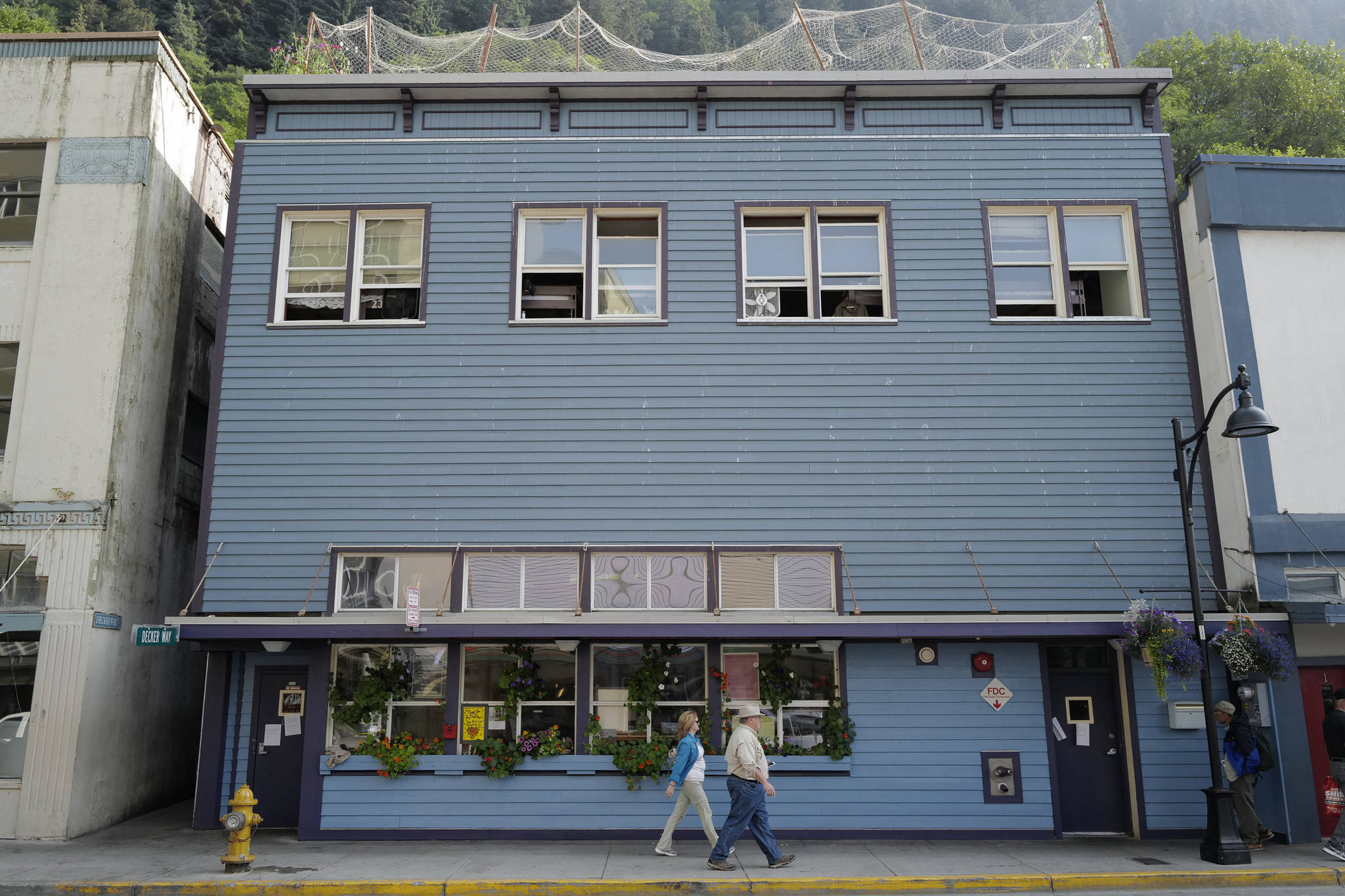 A sign on the front door of the Glory Hall announces its daytime shelter closure on Tuesday, Aug. 13, 2019. However, the shelter is now open from 7 a.m.-9:30 p.m. in light of expectations of near-normal funding. (Michael Penn | Juneau Empire)