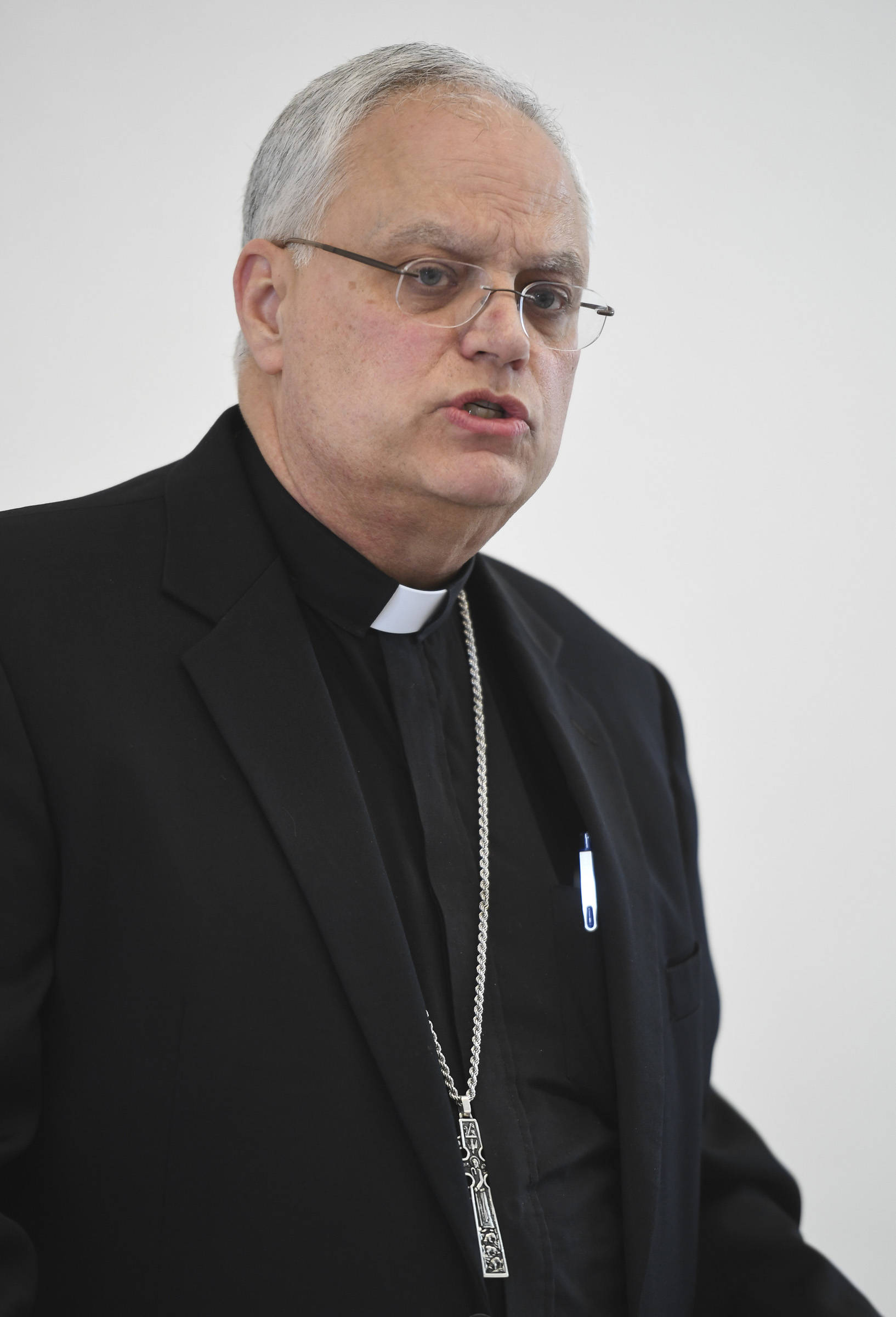 Father Andrew E. Bellisario, the Bishop of the Diocese of Juneau, holds a press conference to talk about an independent review he commissioned on allegations of sexual misconduct by clergymen in the Diocese on Wednesday, Aug. 21, 2019. (Michael Penn | Juneau Empire)