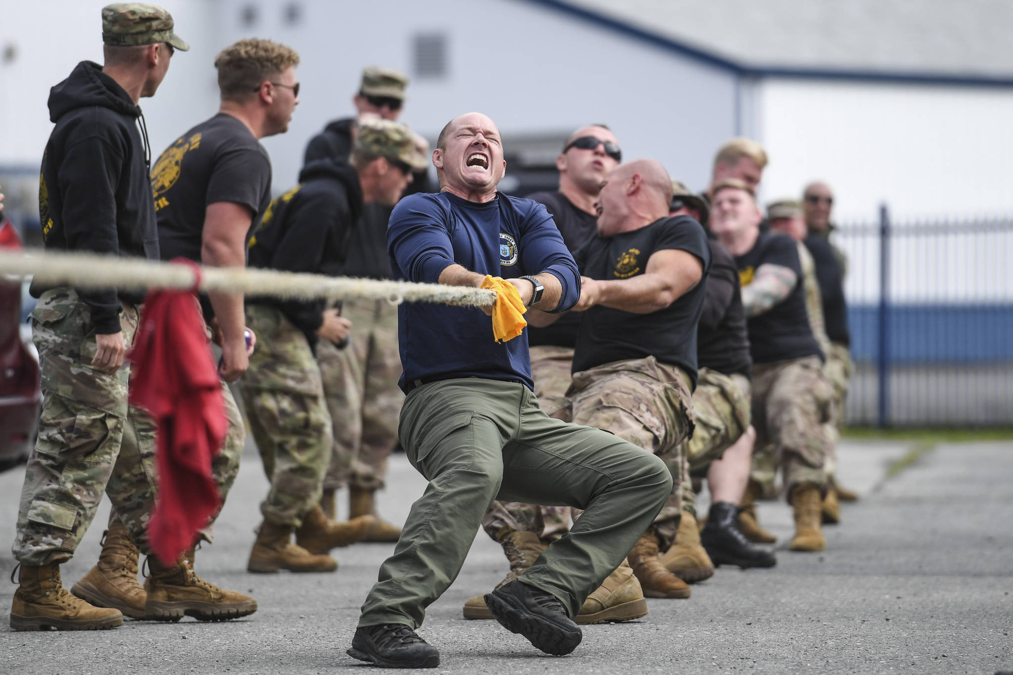 Shawn Price, of the U.S. Army Dive Team, fronts his team during the annual Buoy Tender Olympics at Station Juneau on Wednesday, Aug. 21, 2019. (Michael Penn | Juneau Empire)