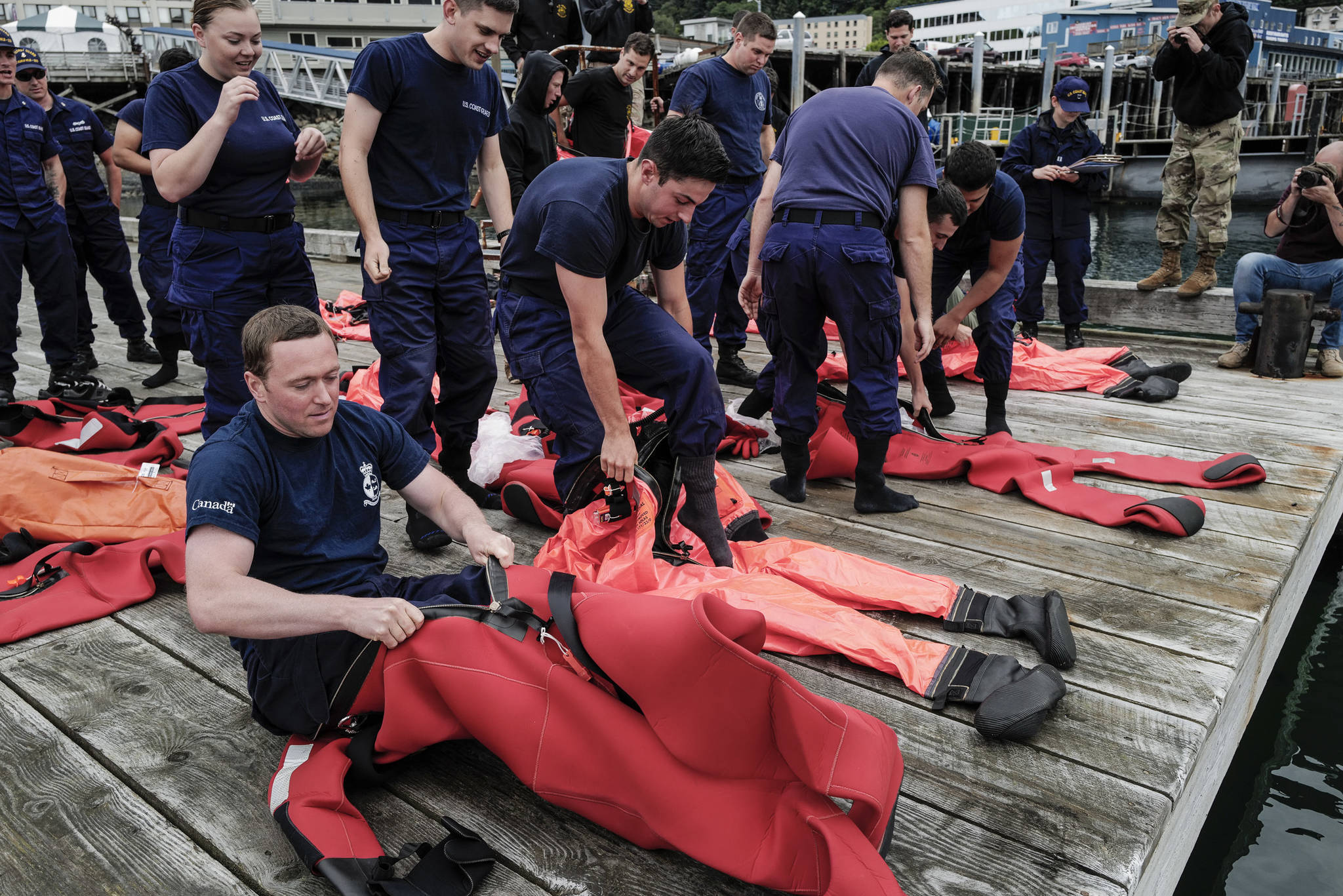 Members of the U.S. Coast Guard, U.S.C.G Dive Team, U.S. Army Dive Team and the Canadian Coast Guard participate in the annual Buoy Tender Olympics at Station Juneau on Wednesday, Aug. 21, 2019. (Michael Penn | Juneau Empire)