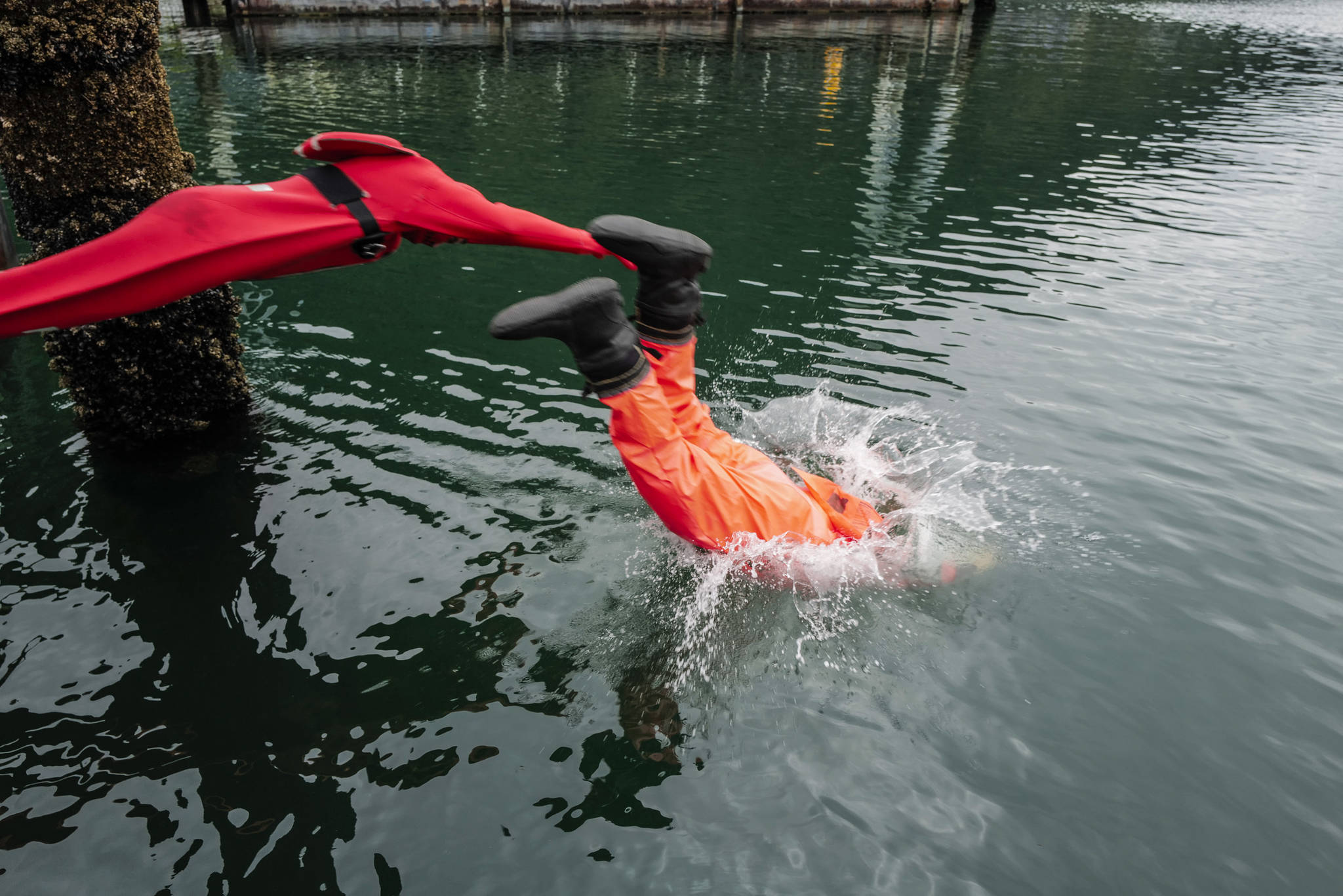 Members of the U.S. Coast Guard, U.S.C.G Dive Team, U.S. Army Dive Team and the Canadian Coast Guard participate in the annual Buoy Tender Olympics at Station Juneau on Wednesday, Aug. 21, 2019. (Michael Penn | Juneau Empire)