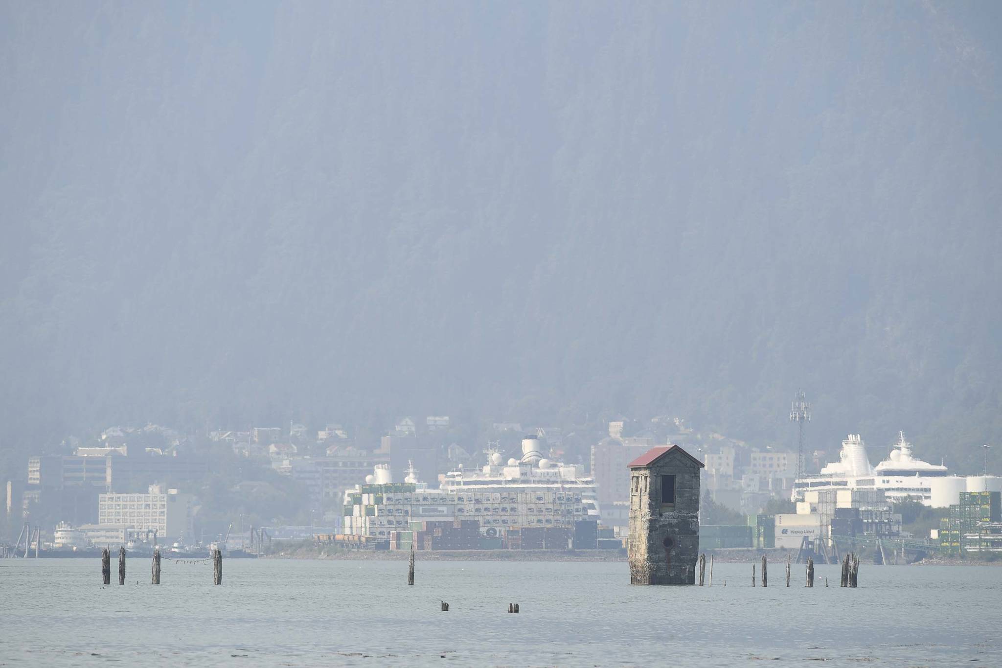 Smoke and haze fill the air to filter the view of downtown Juneau from Douglas Island on Friday, July 5, 2019. (Michael Penn | Juneau Empire)