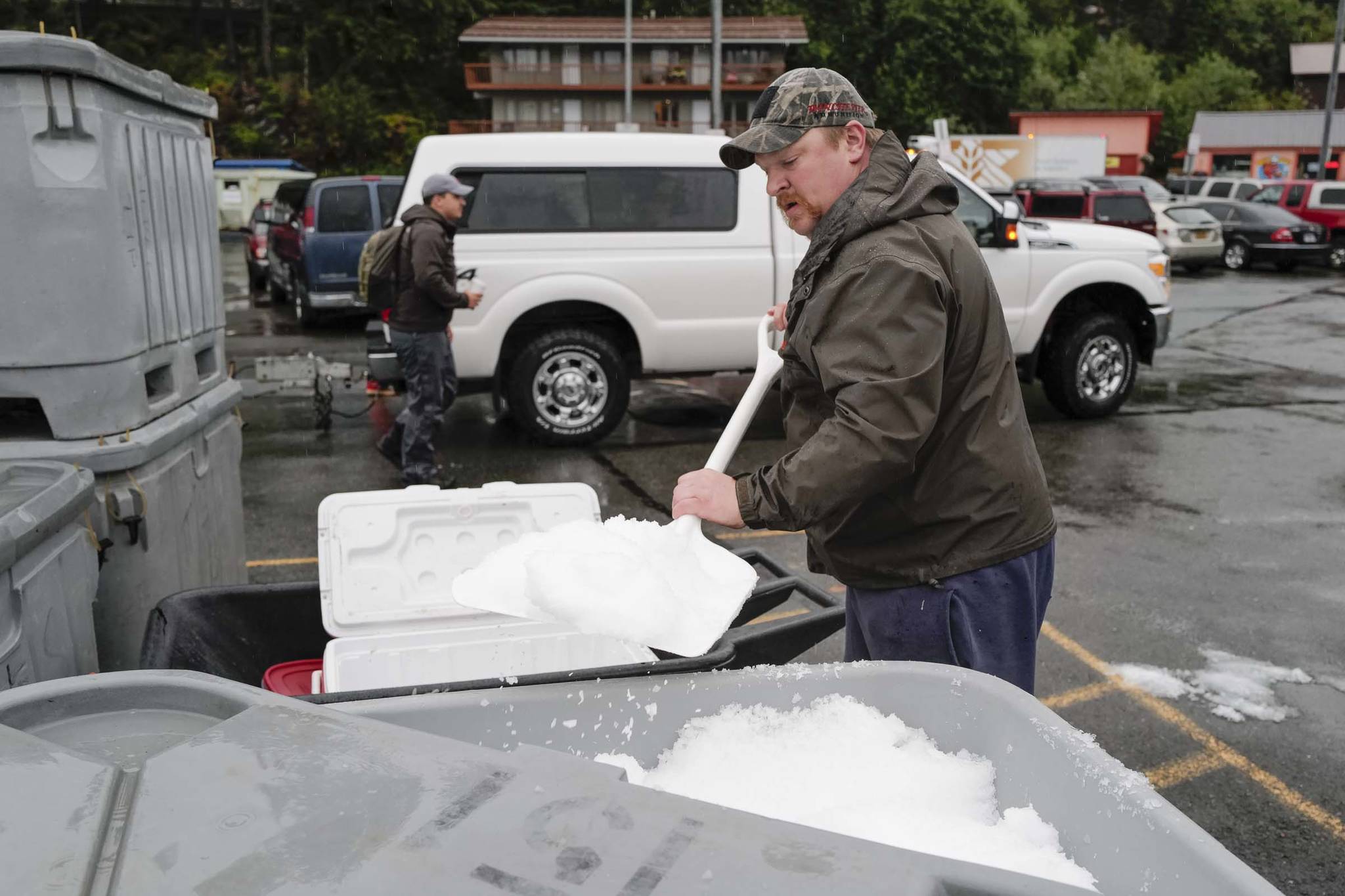 Scott Sell loads up on ice at the Don D. Statter Boat Harbor in Auke Bay at the start of the Golden North Salmon Derby on Friday, Aug. 23, 2019. (Michael Penn | Juneau Empire)