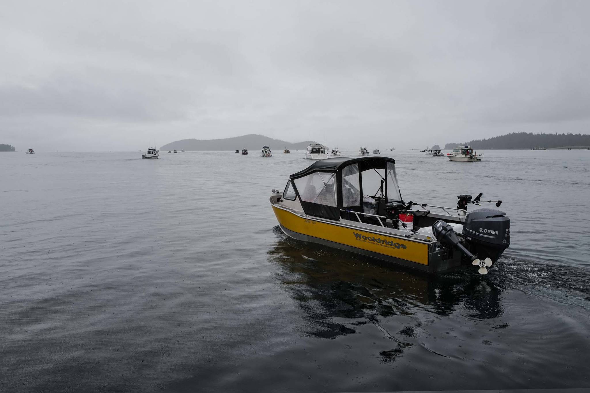 Fishing boats stream out of Don D. Statter Boat Harbor in Auke Bay at the start of the Golden North Salmon Derby on Friday, Aug. 23, 2019. (Michael Penn | Juneau Empire)