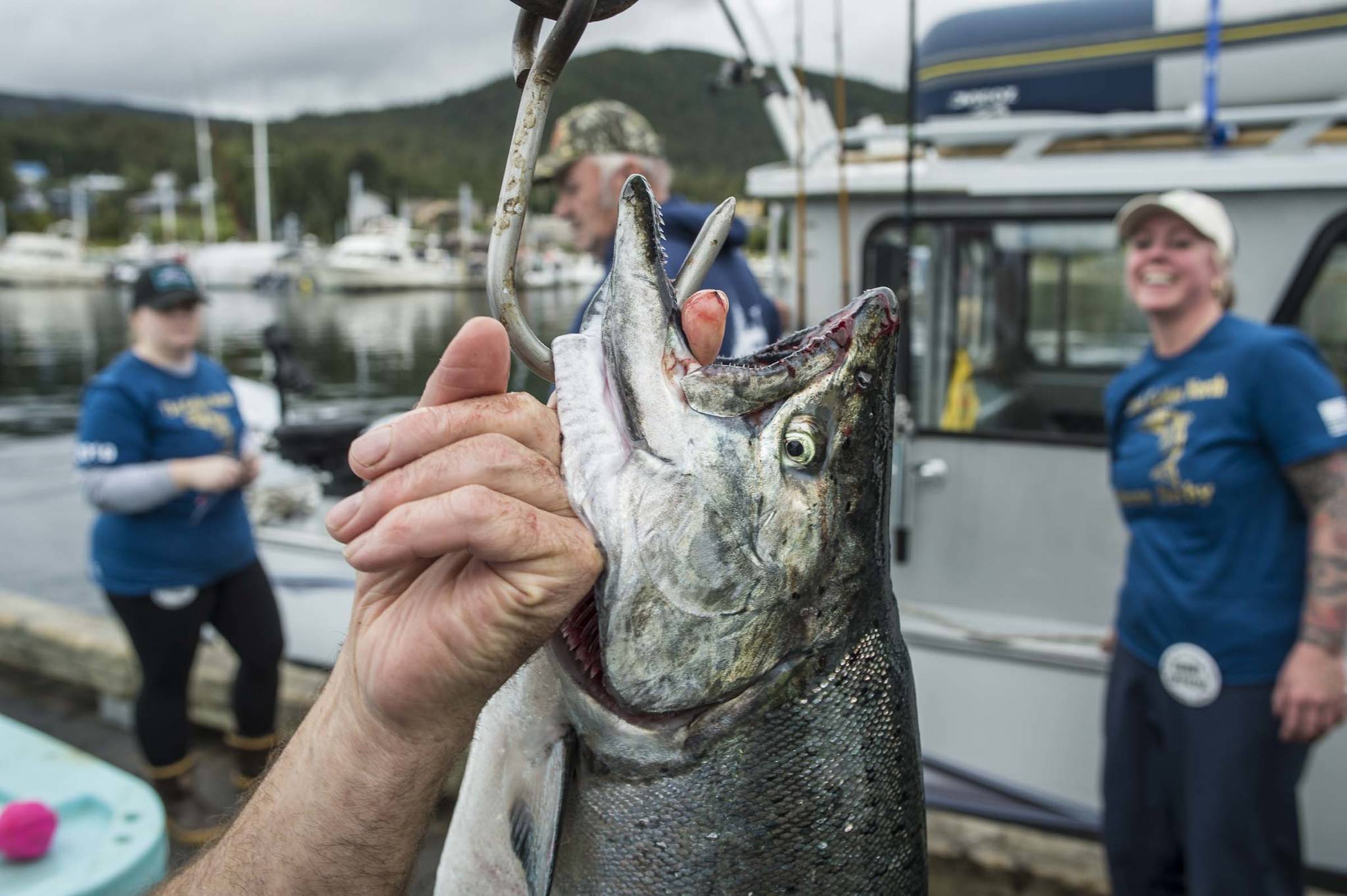 A 20 pound king salmon is lifted of the scale at the Golden North Salmon Derby’s station at the Don D. Statter Memorial Boat Harbor on Saturday, Aug. 24, 2019. (Michael Penn | Juneau Empire)