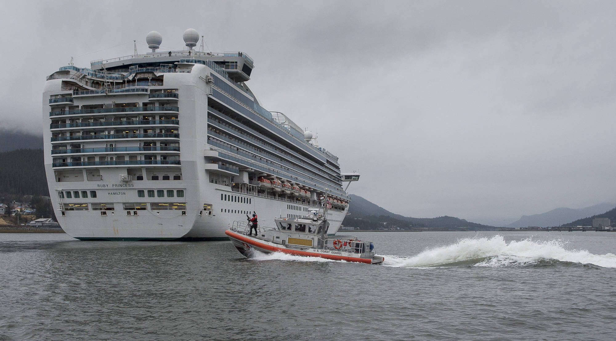 The Ruby Princess is escorted by a U.S. Coast Guard 45 foot Response Boat-Medium into Juneau downtown harbor on Monday, April 30, 2018. (Michael Penn | Juneau Empire)