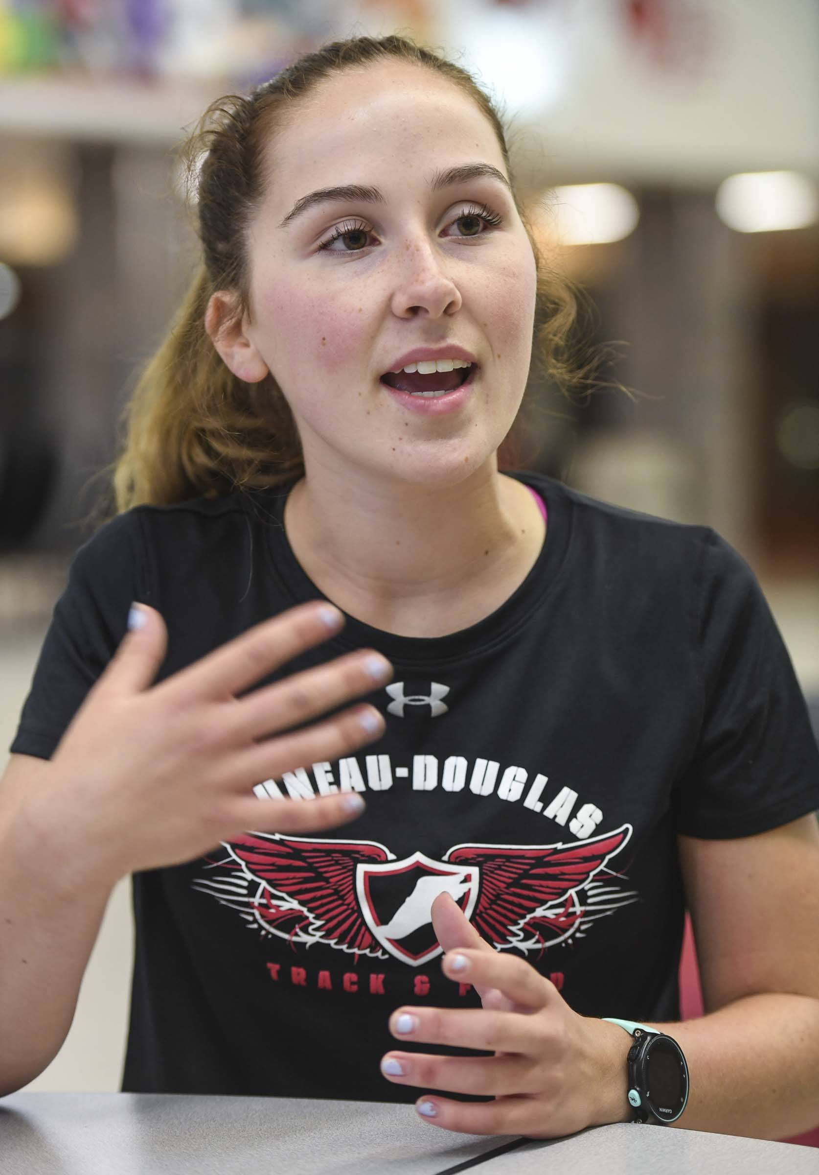 Katie McKenna, a senior at Juneau-Douglas High School:Yadaat.at Kalé, talks about her competitive running and social justice interests during an interview at JDHS on Thursday, Aug. 22, 2019. (Michael Penn | Juneau Empire)