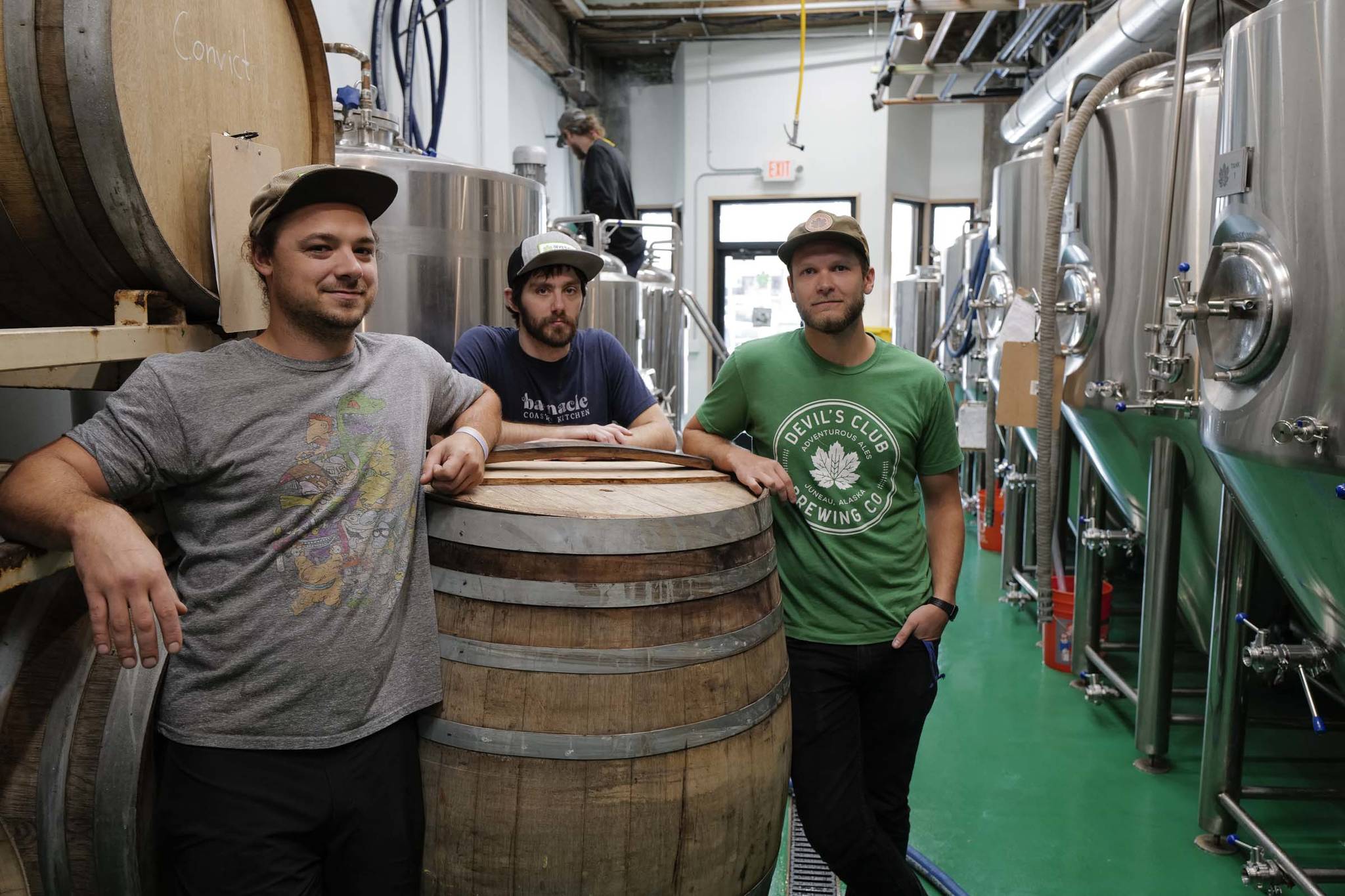 Jake Ridle, left, Ryan Lindsay, center, and Evan Wood in their Devil’s Club Brewing Company brewery on Tuesday, Aug. 27, 2019. (Michael Penn | Juneau Empire)