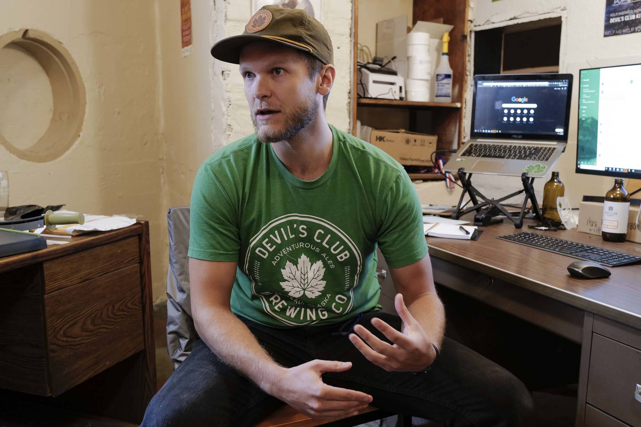 Evan Wood, one of the owners of Devil’s Club Brewing Company, talks Tuesday, Aug. 27, 2019, about what proposed rule changes for Alaska’s breweries and distilleries would mean for his business. (Michael Penn | Juneau Empire)