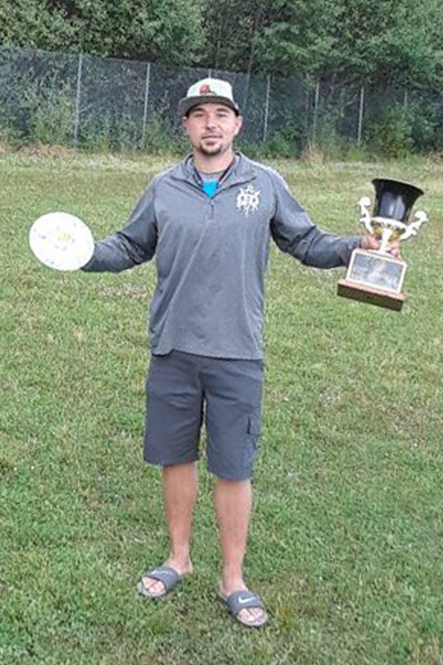 Joe Schacht, of Anchorage, poses with the Greatland Cup Disc Golf Tournament trophy at Aant’iyeik Park. (Courtesy Photo | Russell Sandstrom)