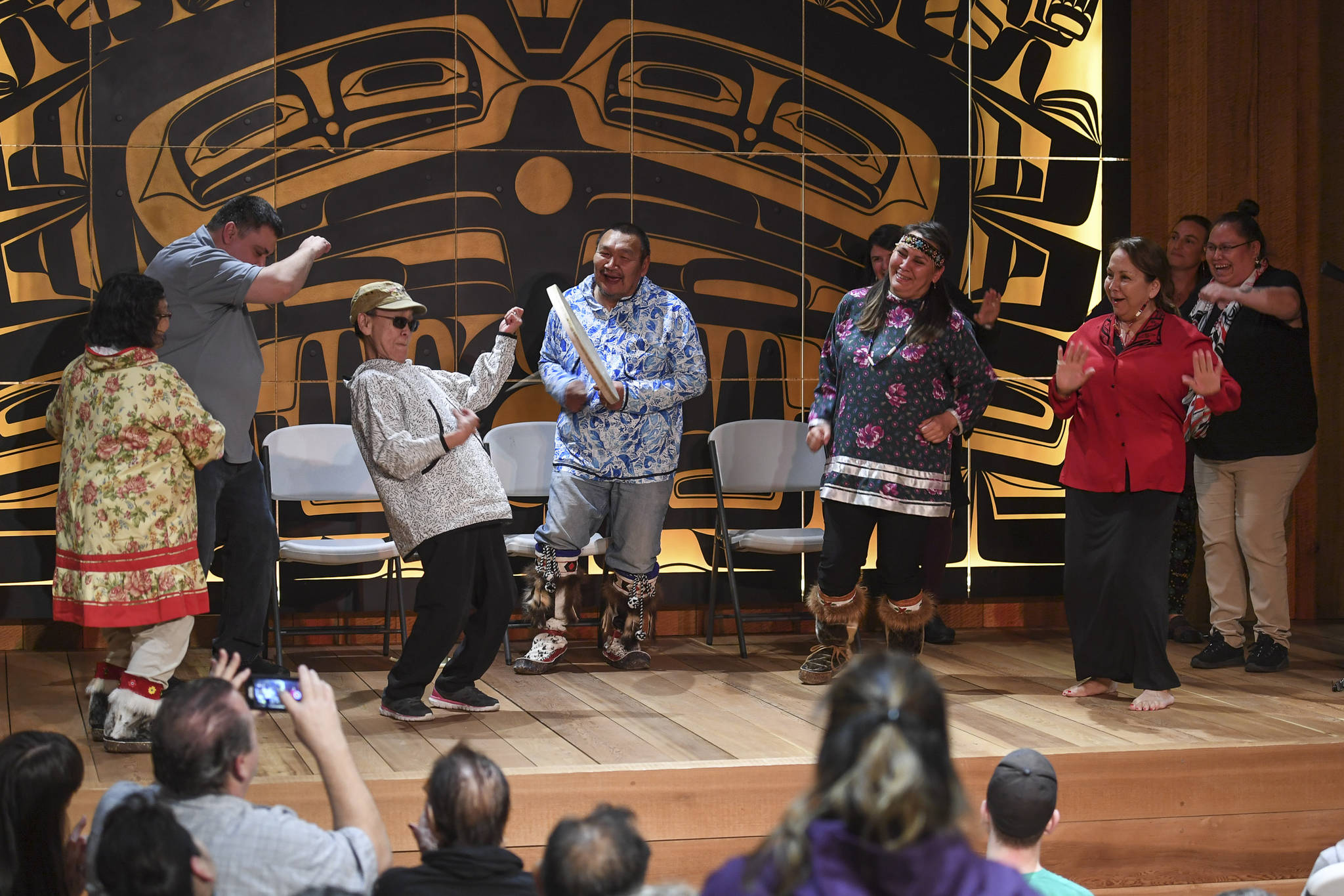 Sealaska Heritage Institute Artists-in-Residence John Waghiyi Jr. and his wife, Arlene Annogiyuk Waghiyi, from Savoonga, invite audience members to dance to their St. Lawrence Island rock and roll song at the Walter Soboleff Center on Wednesday, Aug. 28, 2019. (Michael Penn | Juneau Empire)
