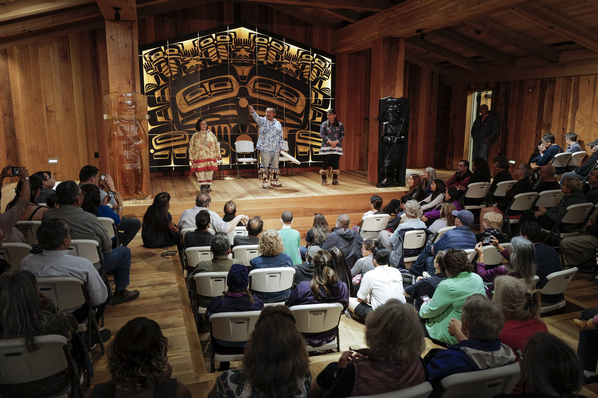 Sealaska Heritage Institute Artists-in-Residence John Waghiyi and his wife, Arlene Annogiyuk Waghiyi, from Savoonga, perform St. Lawrence Island dancing and song with their niece, Rana Mokiyuk, right, at the Walter Soboleff Center on Wednesday, Aug. 28, 2019. (Michael Penn | Juneau Empire)