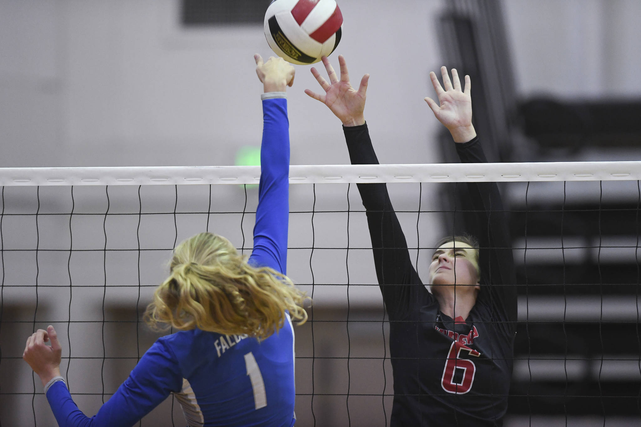Thunder Mountain’s Marlee Smith, left, and Juneau-Douglas’ Addie Prussing compete for the ball at the Volleyball Jamboree at Juneau-Douglas High School: Yadaa.at Kalé on Friday, Aug. 30, 2019. (Michael Penn | Juneau Empire)