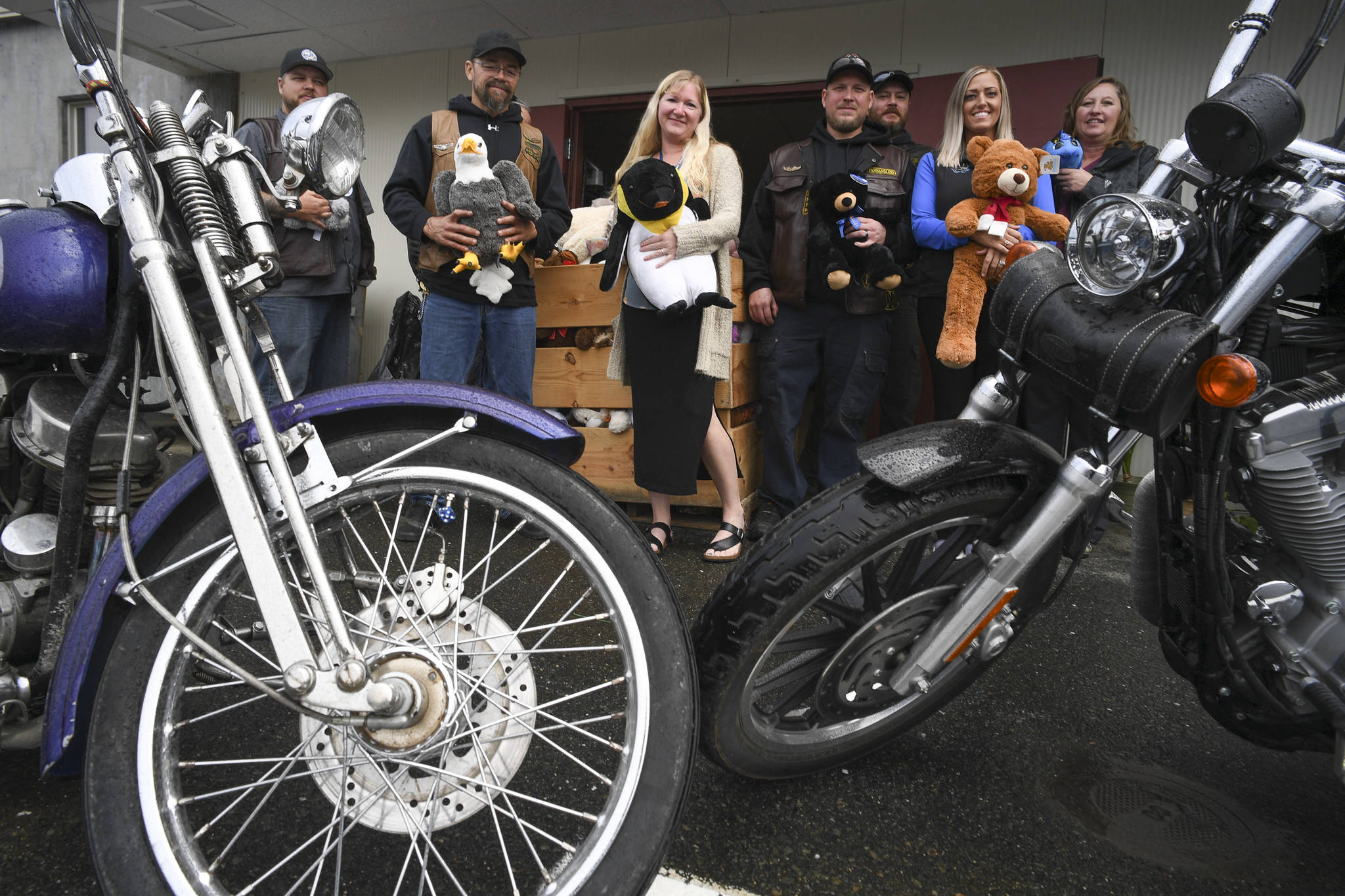 Members of the Panhandlers Motorcycle Club of Alaska pose with staff at Bartlett Regional Hospital on Tuesday, Sept. 3, 2019, with toys collected during the 25th Annual Toy Run for young patients and visitors to the hospital. (Michael Penn | Juneau Empire)
