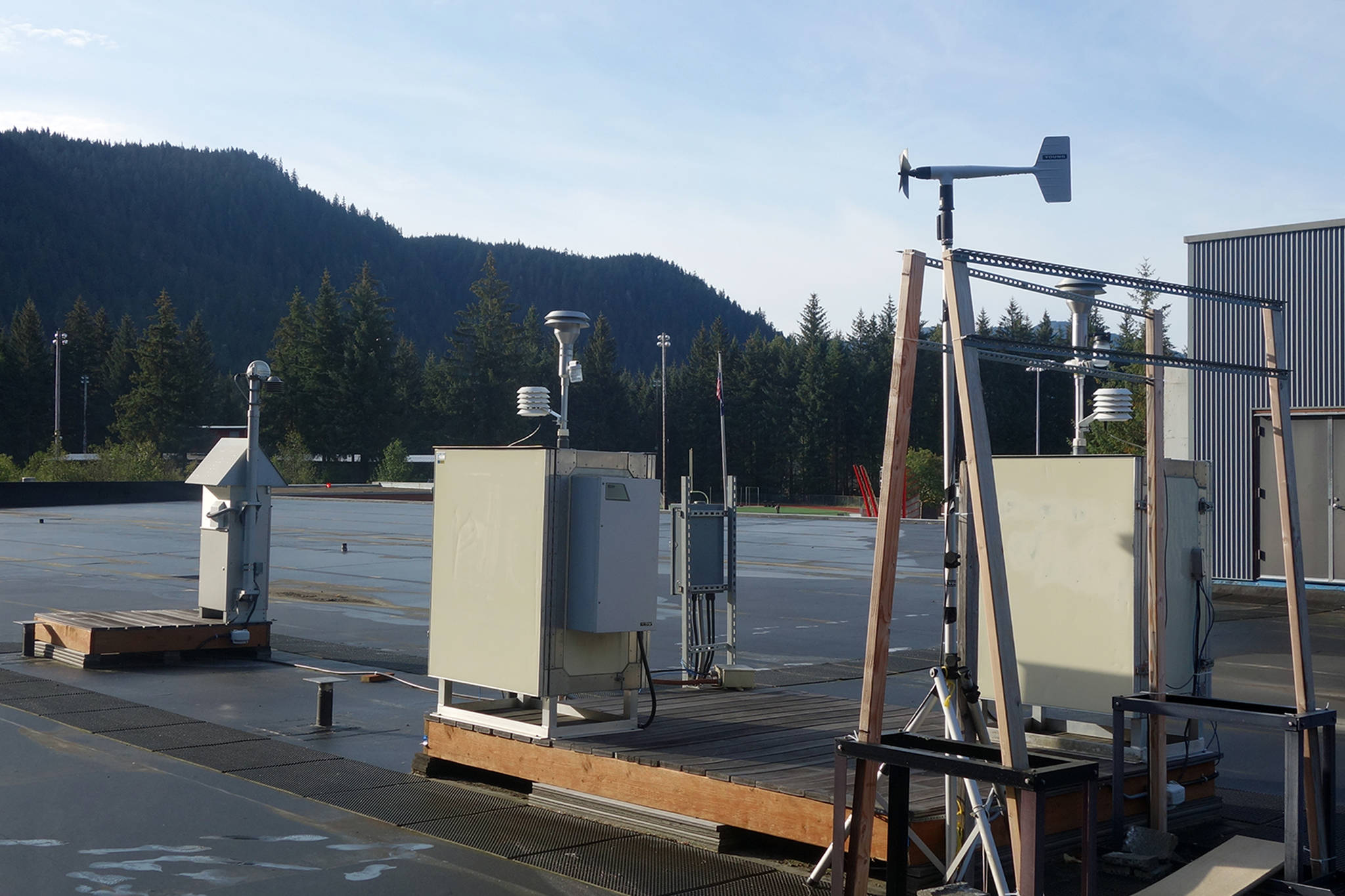 Twenty air monitors distributed around downtown Juneau will eventually join this air monitoring equipment on top of Floyd Dryden Middle School roof. (Ben Hohenstatt | Juneau Empire)