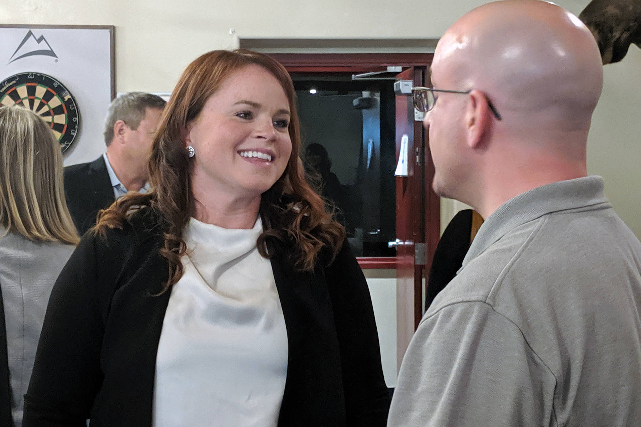 District Attorney Angie Kemp speaks with Assembly member Wade Bryson after her Greater Juneau Chamber of Commerce luncheon presentation, Thursday, Sept. 5, 2019. (Ben Hohenstatt | Juneau Empire)