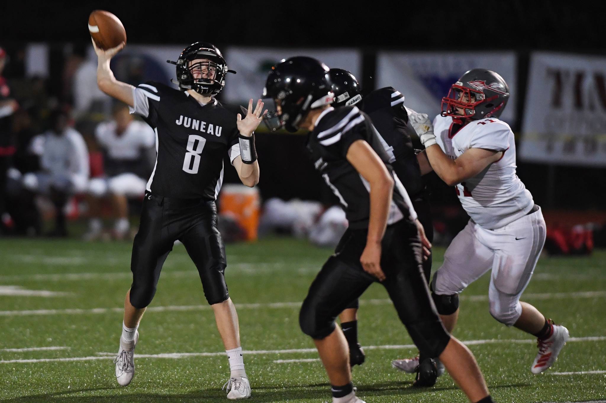 Juneau’s quarterback Noah Chambers throws for a touchdown and a 42-0 lead in the second quarter against Wasilla at Adair-Kennedy Memorial Field on Friday, Sept. 6, 2019. (Michael Penn | Juneau Empire)