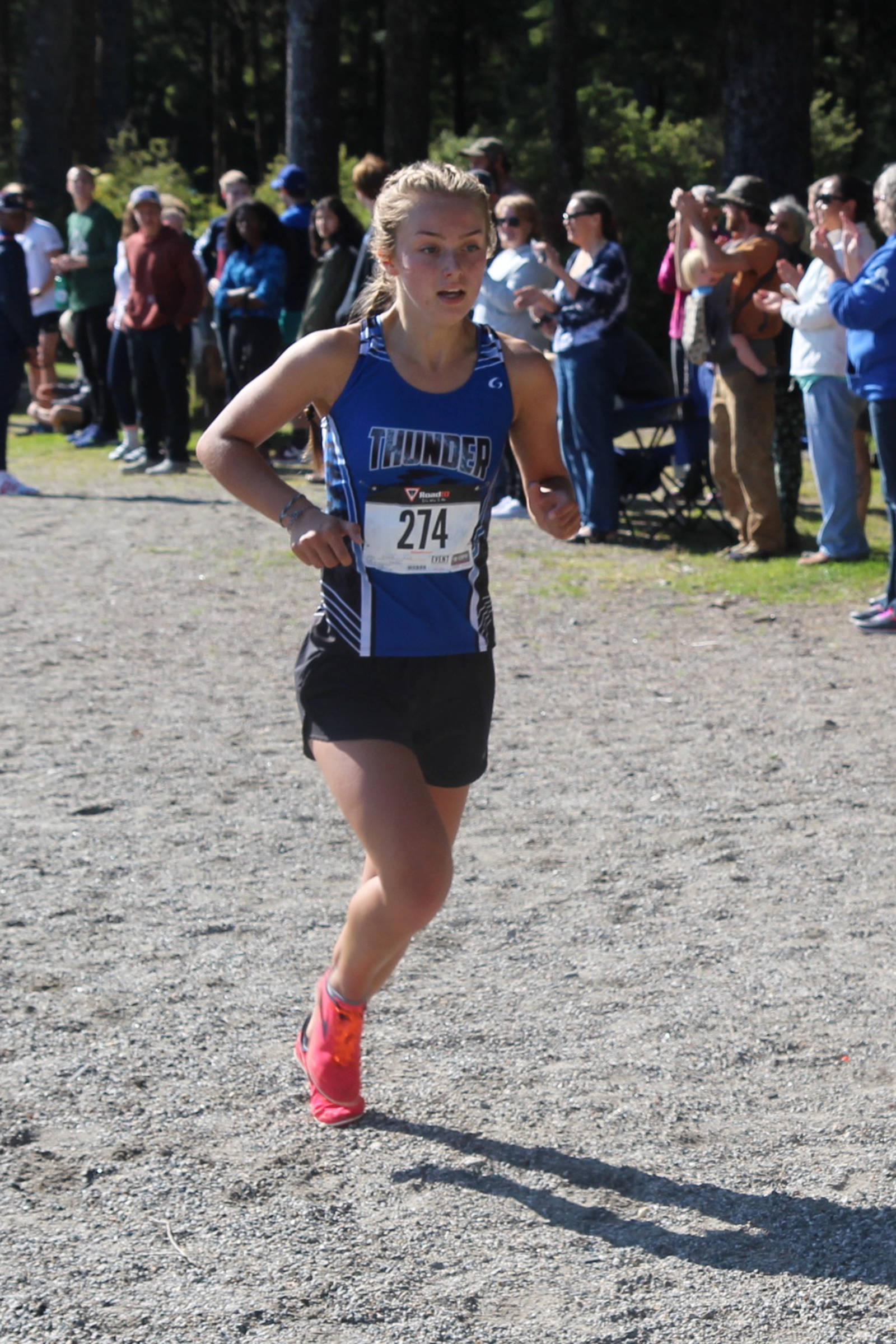 Thunder Mountain High School’s Kiah Dihle closes in on a first-place finish in the Petersburg Invitational cross country meet at Sandy Beach Park on Saturday, Sept. 7, 2019. Dihle completed the 5-kilometer course in 19 minutes, 54 seconds. (Brian Varela | Petersburg Pilot)