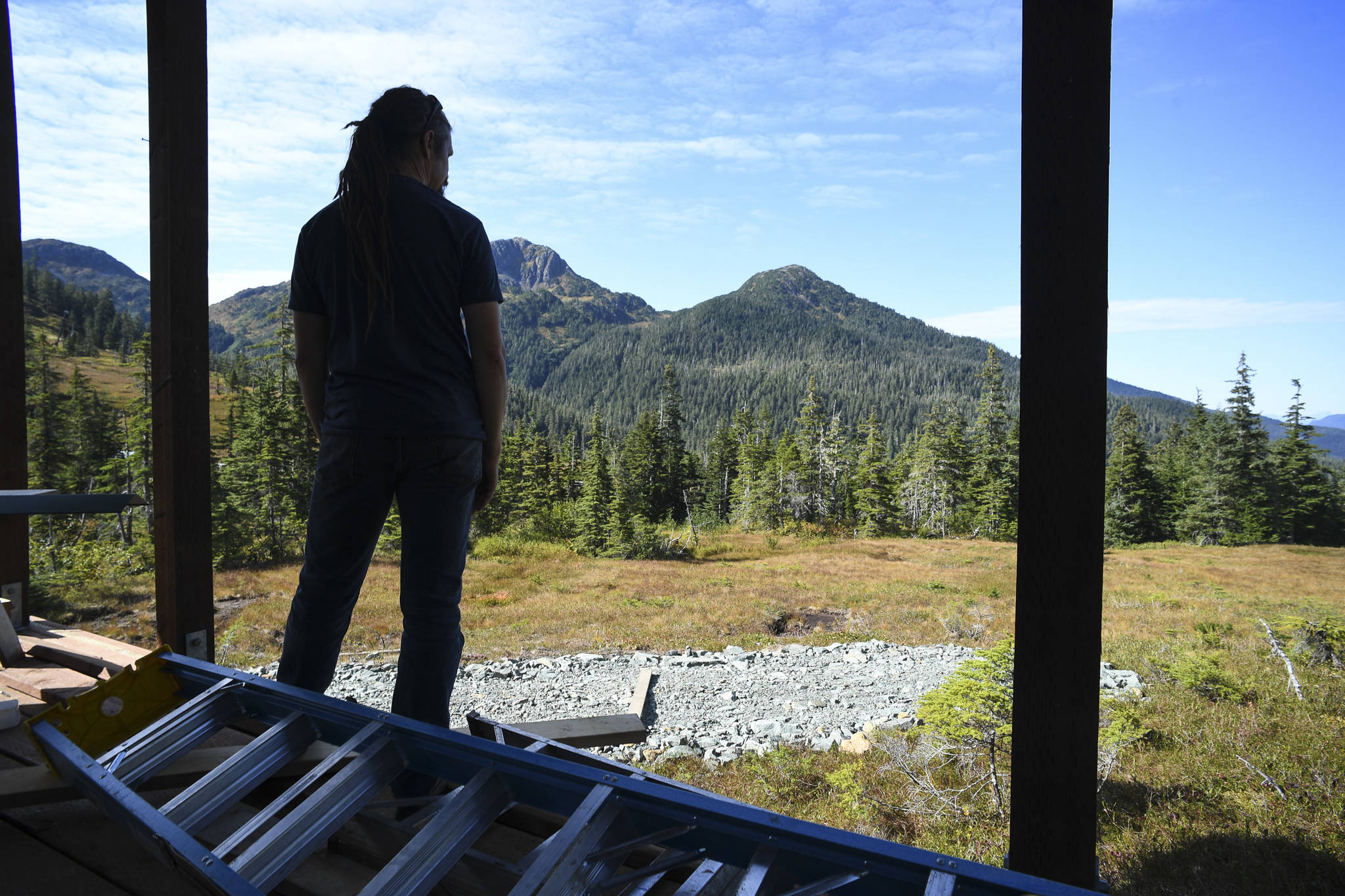 General Manager Dave Scanlan takes in the view from the front deck of the nearly complete Hilda Dam Cabin at Eaglecrest Ski Area on Monday, Sept. 9, 2019. The first city-owned cabin, that can sleep eight, will be open for rental in mid-October according to Scanlan. (Michael Penn | Juneau Empire)