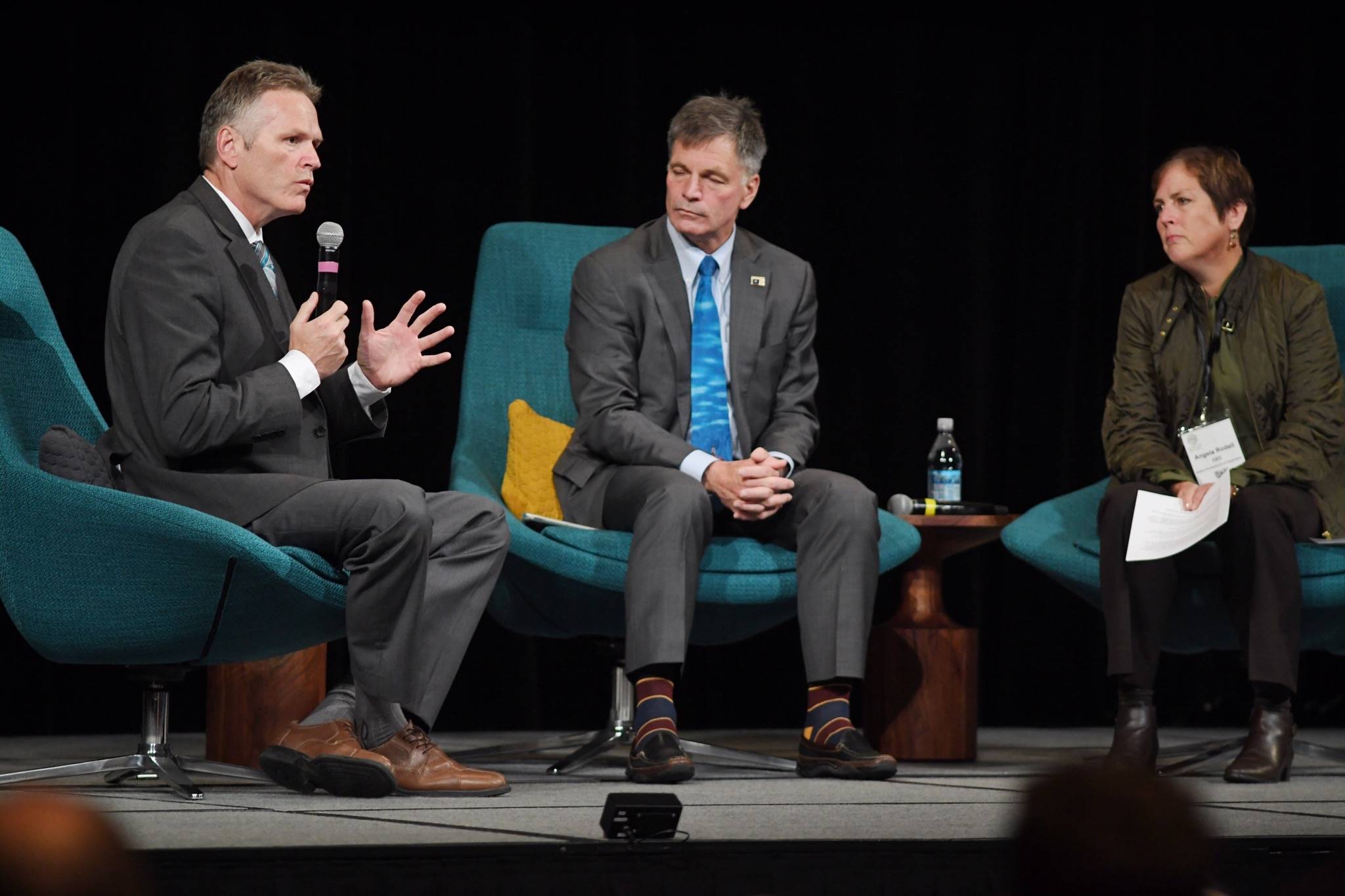 Alaska Gov. Mike Dunleavy, left, speaks with Wyoming Gov. Mark Gordon and Alaska Permanent Fund Corporation CEO Angela Rodell during the annual meeting of the International Forum of Sovereign Wealth Funds at Centennial Hall on Thursday, Sept. 12, 2019. (Michael Penn| Juneau Empire)