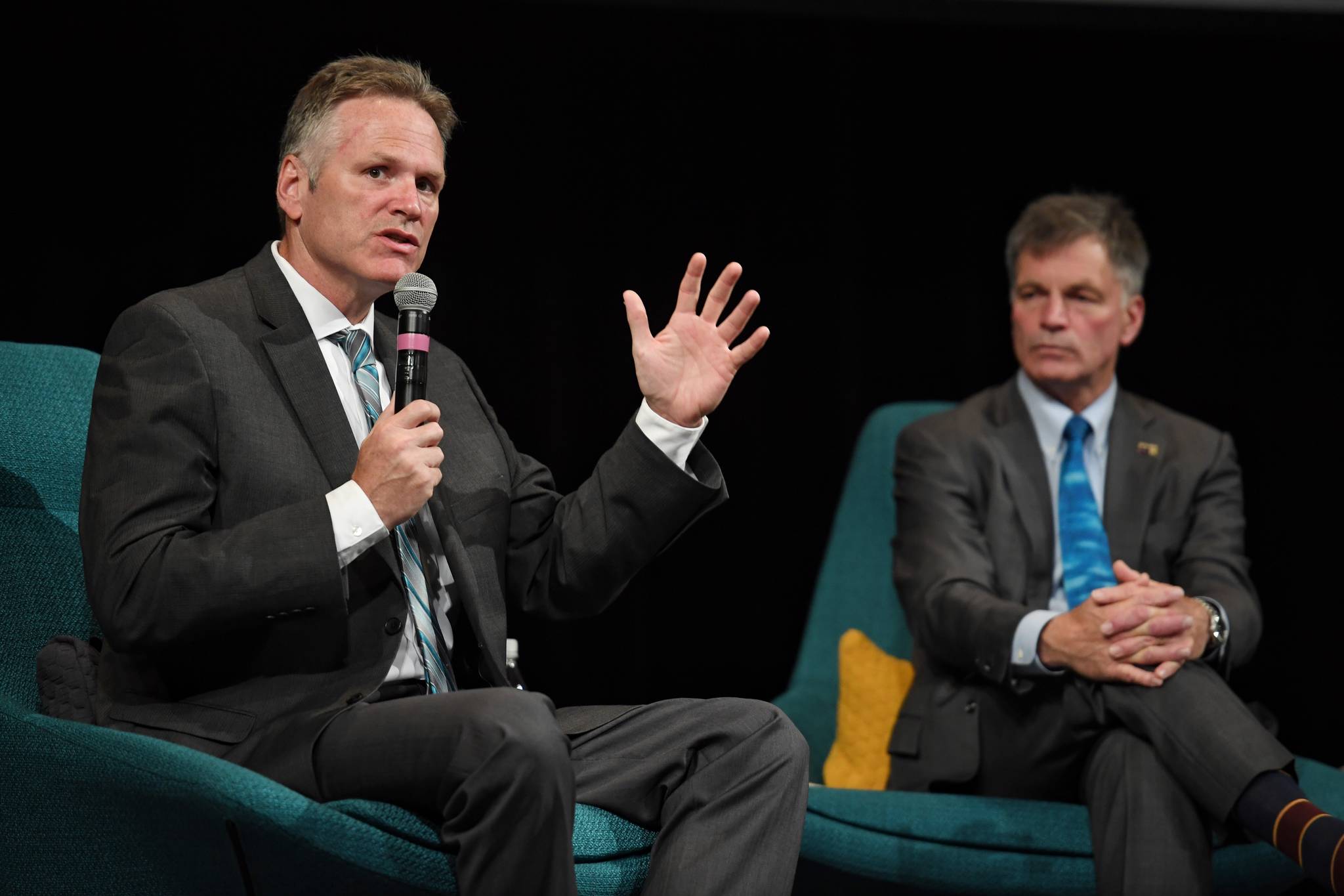 Alaska Gov. Mike Dunleavy and Wyoming Gov. Mark Gordon speak during the International Forum of Sovereign Wealth Funds’ annual meeting Thursday, Sept. 12, 2019, at Centennial Hall. The two governors were part of a panel discussion during the yearly gathering of state-owned investment funds. (Michael Penn | Juneau Empire)