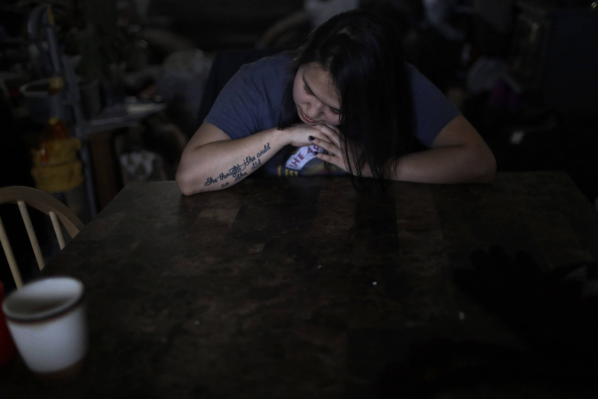 In this Feb. 16 photo, Deidre Levi rests her head for a moment in her grandmother’s house before a basketball game in the Native Village of St. Michael. Levi says she spoke up about being sexually assaulted because she wanted to be a role model for girls in Alaska. (AP Photo | Wong Maye-E)