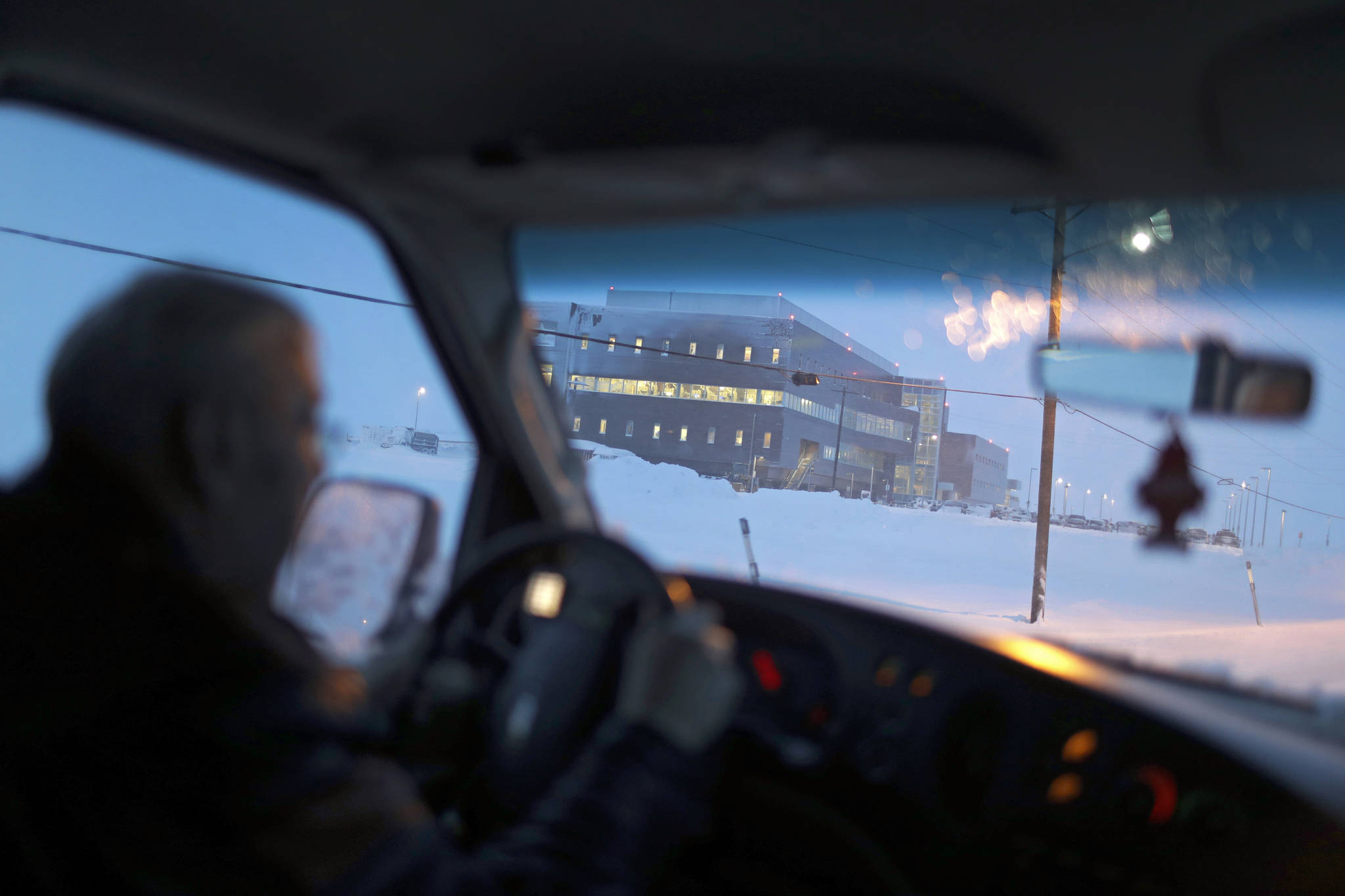 In this Feb. 21 photo, the Norton Sound Regional Hospital is seen through a taxi windshield during a storm in Nome. The main hospital serving residents in the Bering Strait region is located about a mile from downtown Nome. (AP Photo | Wong Maye-E)