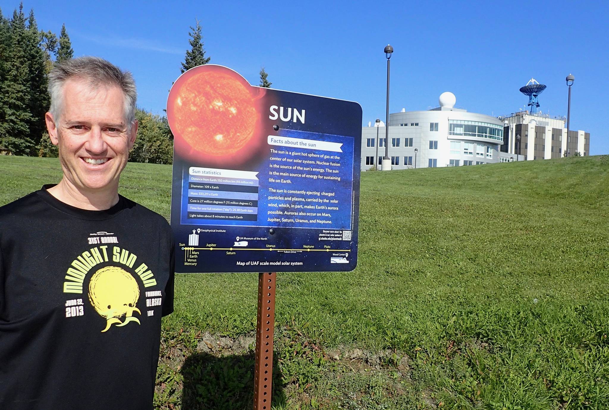 Space physics expert Peter Delamere at the start of the new UAF Planet Walk in Fairbanks. (Ned Rozell | For the Juneau Empire)
