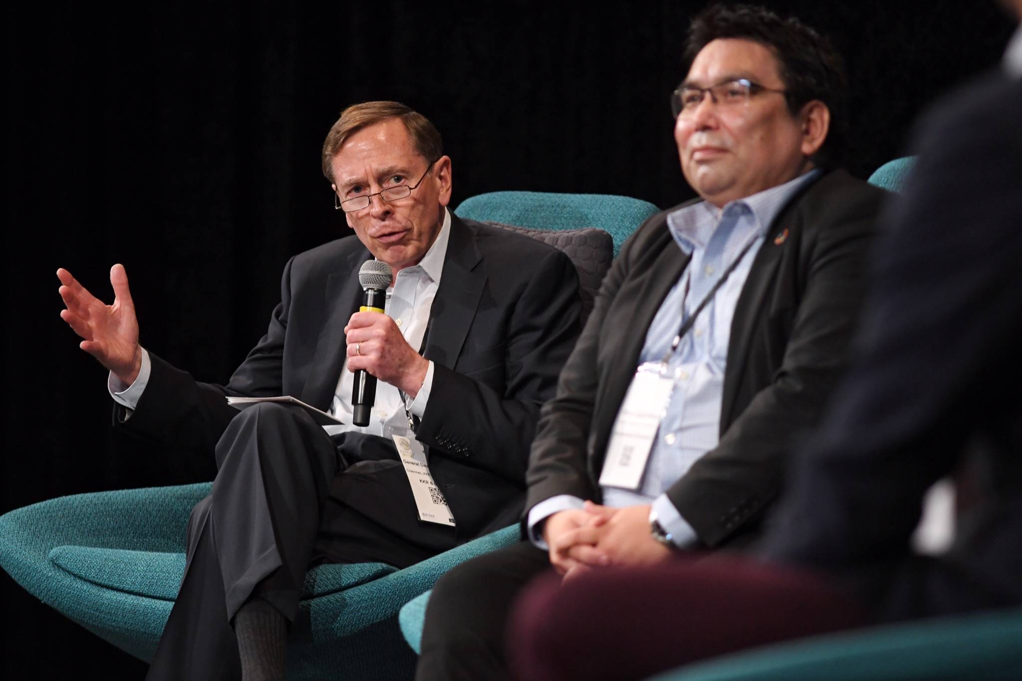 David Petraeus, Chairman of the KKR Global Institute, left, speaks during a panel discussion, including Vittus Qujaukitsoq, Minister for Finance and Nordic Cooperation for the government of Greenland, right, at the annual meeting of the International Forum of Sovereign Wealth Funds at Centennial Hall on Thursday, Sept. 12, 2019. (Michael Penn | Juneau Empire)