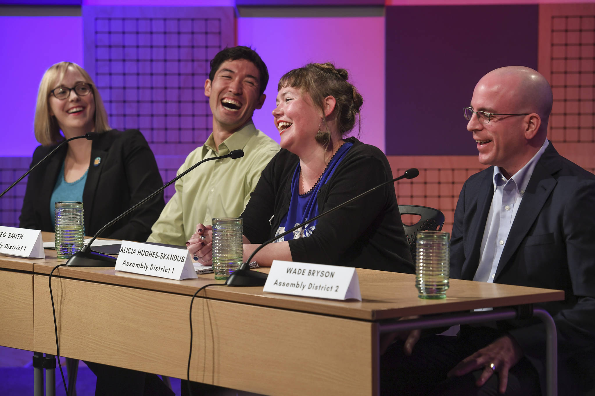 Assembly candidates Carole Triem, left, Greg Smith, Alicia Hughes-Skandijs and Wade Bryson share a light moment during a candidate forum at KTOO on Tuesday, Sept. 17, 2019. The event was sponsored by the Juneau League of Women Voters. (Michael Penn | Juneau Empire)