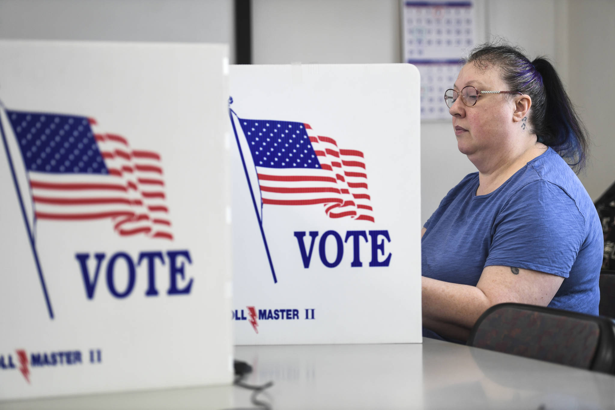 Darcy Stetson casts her ballot during early voting at City Hall on Tuesday, Sept. 17, 2019. Early voting is happening at City Hall, Mondays–Fridays, 8 a.m.-4:30 p.m. and at the Mendenhall Mall Annex, Mondays-Fridays, 11 a.m.-6 p.m. and Saturdays, Sept. 21 and 28 from noon-4 p.m. (Michael Penn | Juneau Empire)