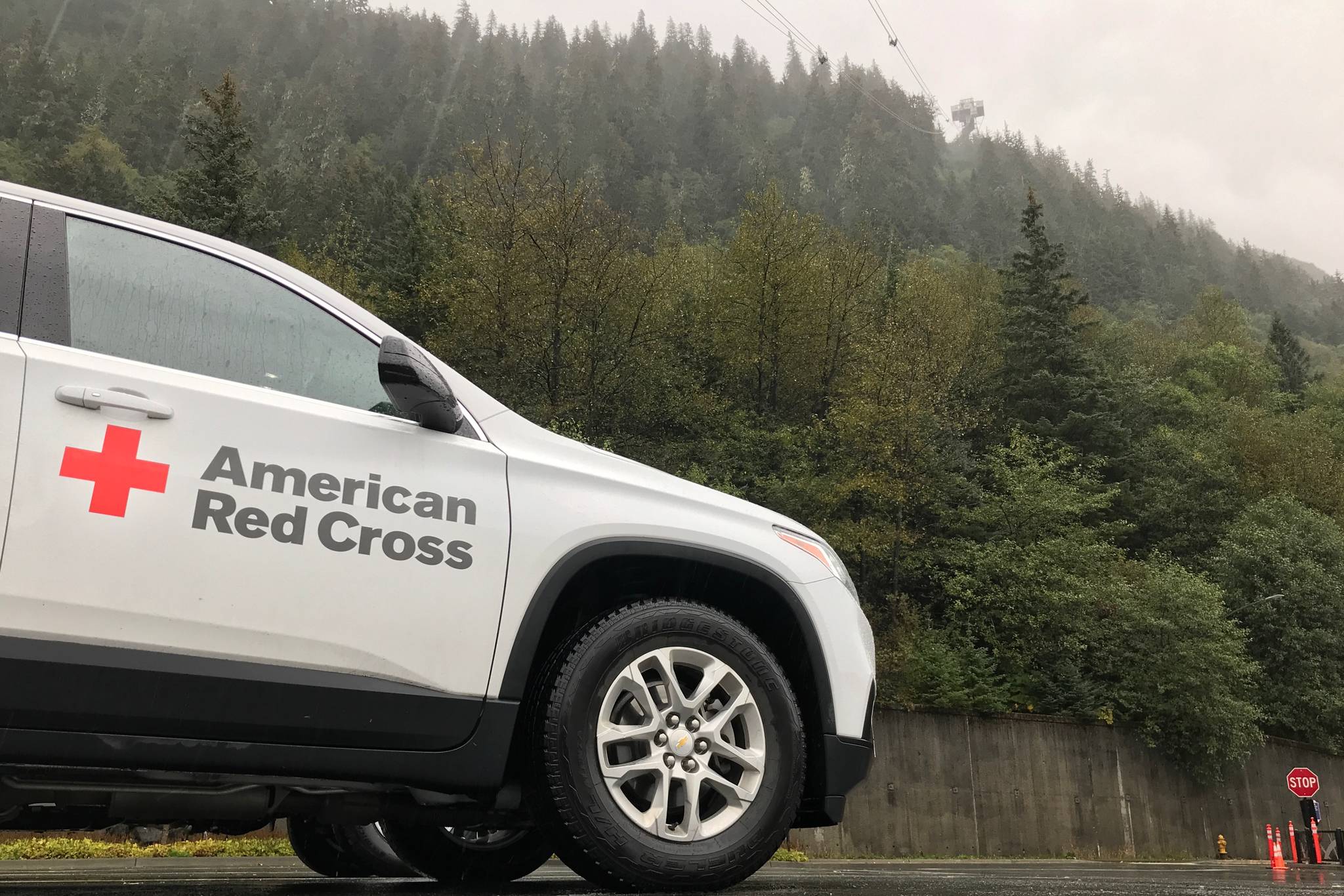 A Red Cross vehicle waits at the scene of a search and rescue for a stranded hiker on Mount Roberts. (Michael Penn | Juneau Empire)