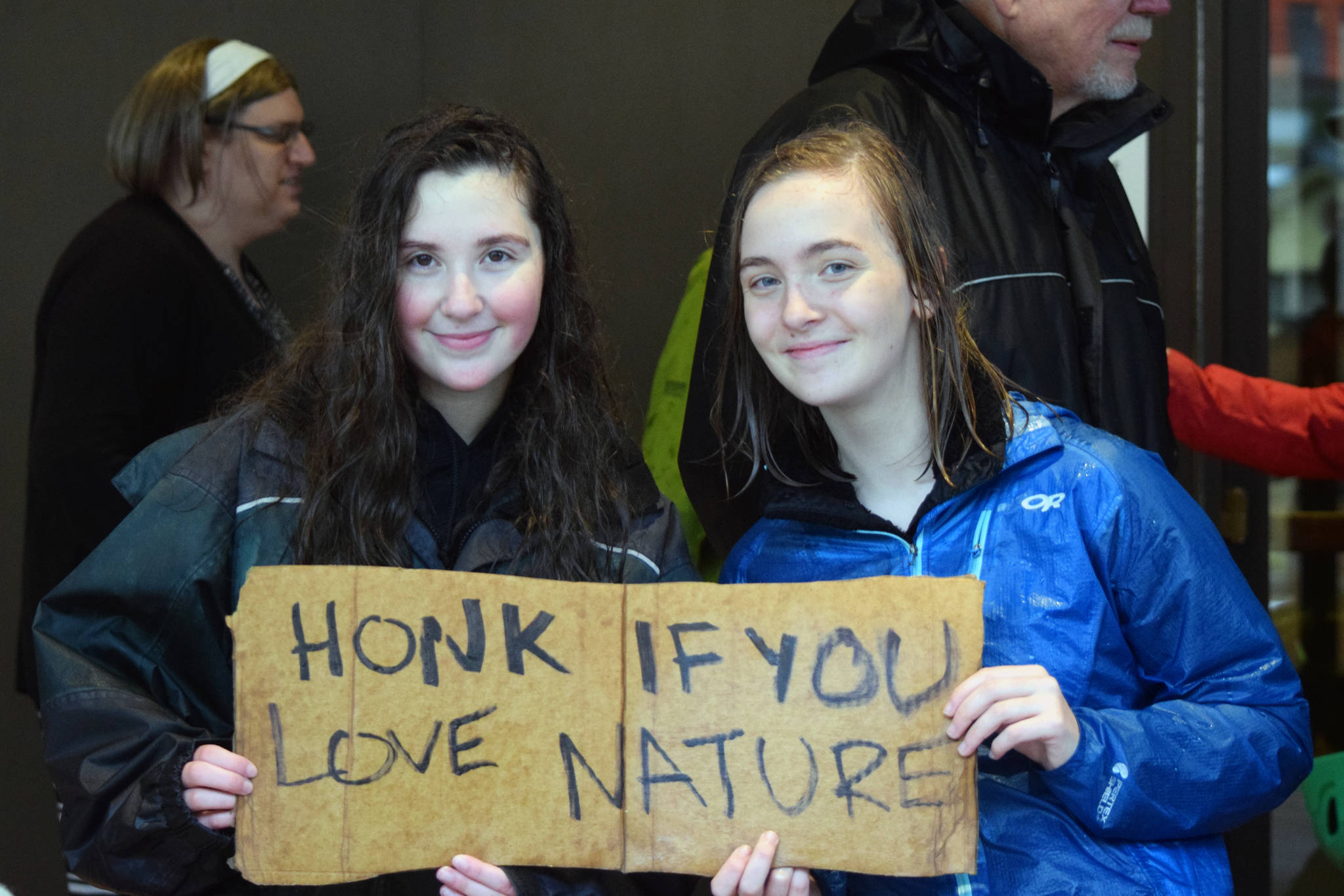Emma Magnusson, 15, a homeschool student, and Lera Jimmerson, 16, of Thunder Mountain High School, outside the State Office Building on Friday, Sept. 20, 2019. (Peter Segall | Juneau Empire)