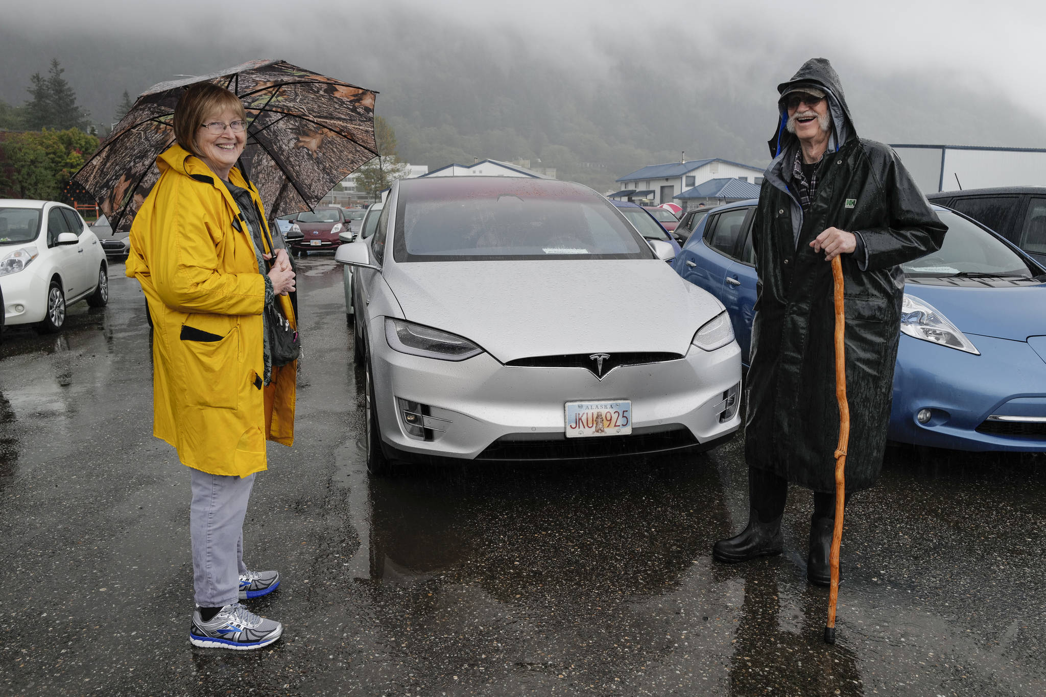 Cheryl and Henry Jebe pose with their Tesla Model X as Juneau residents meet for the sixth annual Electric Vehicle Juneau Roundup on Saturday, Sept. 21, 2019. (Michael Penn | Juneau Empire)