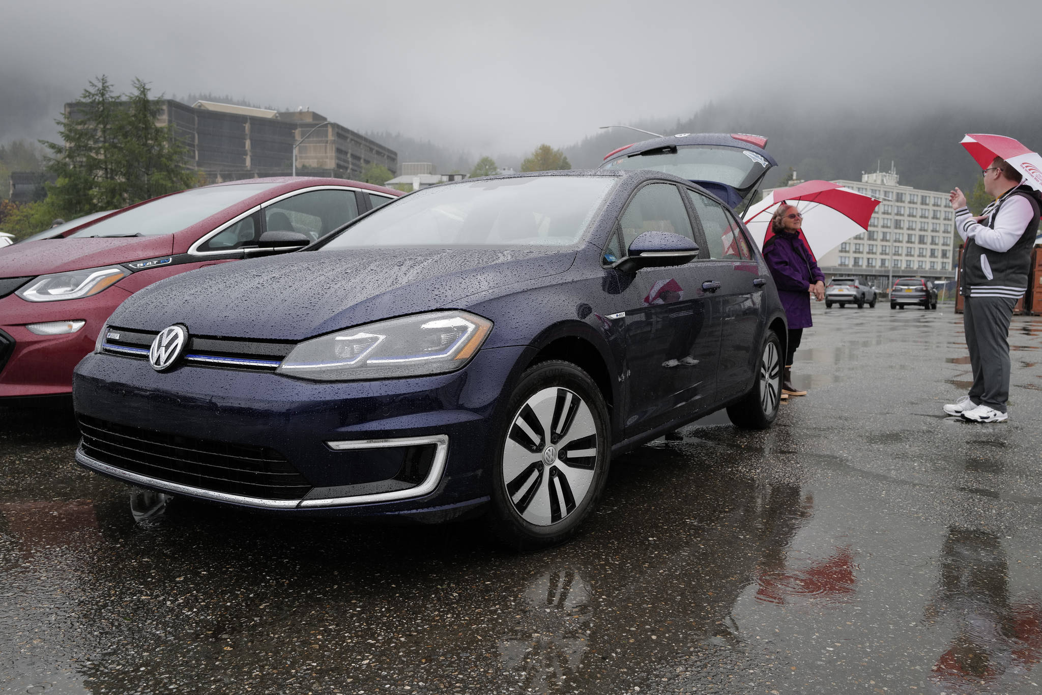Nancy Waterman talks about her electric Volkswagen vehicle as Juneau residents meet for the Sixth Annual Electric Vehicle Juneau Roundup on Saturday, Sept. 21, 2019. (Michael Penn | Juneau Empire)